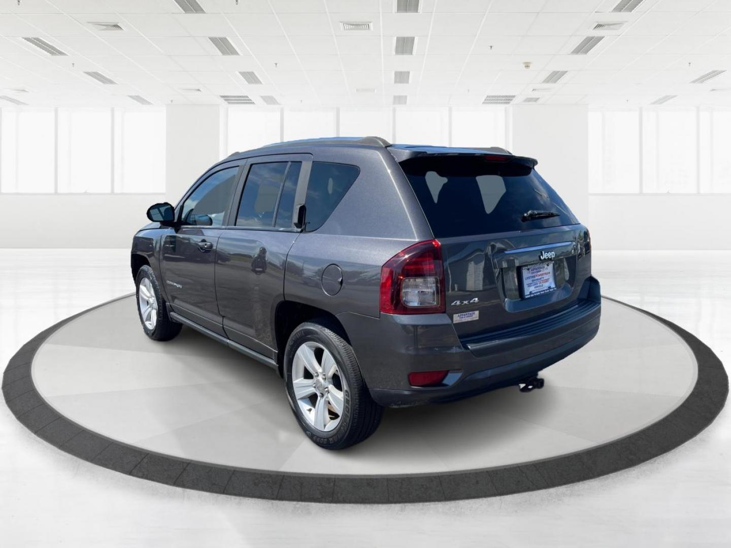 2014 Granite Crystal Met CC Jeep Compass (1C4NJDBBXED) with an 2.4L L4 DOHC 16V engine, located at 401 Woodman Dr, Riverside, OH, 45431, (937) 908-9800, 39.760899, -84.123421 - Photo#4