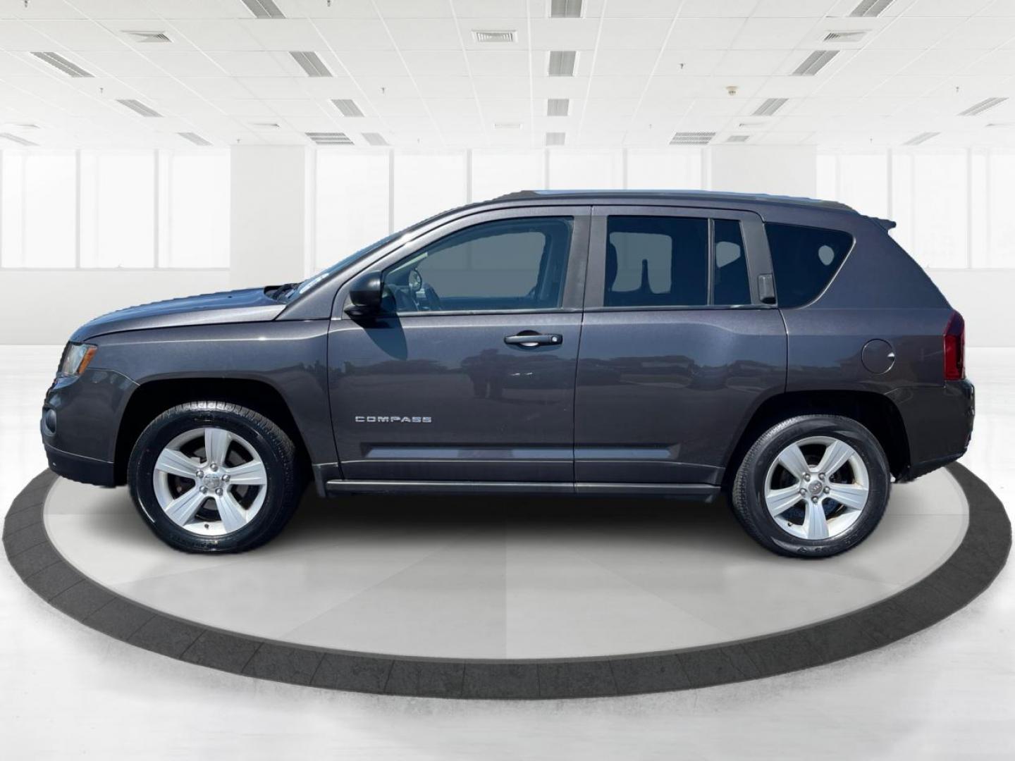 2014 Granite Crystal Met CC Jeep Compass (1C4NJDBBXED) with an 2.4L L4 DOHC 16V engine, located at 401 Woodman Dr, Riverside, OH, 45431, (937) 908-9800, 39.760899, -84.123421 - Photo#5