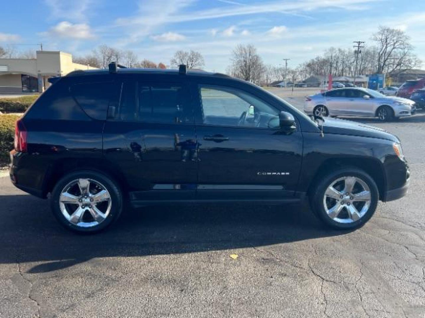 2014 Black Clearcoat Jeep Compass Latitude 4WD (1C4NJDEB5ED) with an 2.4L L4 DOHC 16V engine, Continuously Variable Transmission transmission, located at 1099 N County Rd 25A, Troy, OH, 45373, (937) 908-9800, 40.057079, -84.212883 - Photo#5