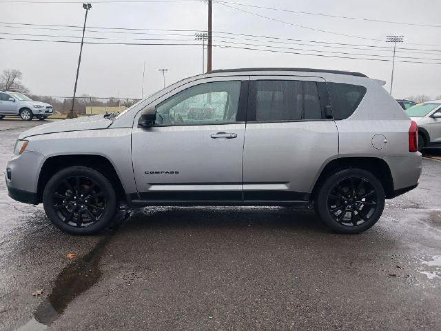 2014 Bright Silver Metallic CC Jeep Compass Sport FWD (1C4NJCBAXED) with an 2.0L L4 DOHC 16V engine, located at 1099 N County Rd 25A, Troy, OH, 45373, (937) 908-9800, 40.057079, -84.212883 - Photo#3