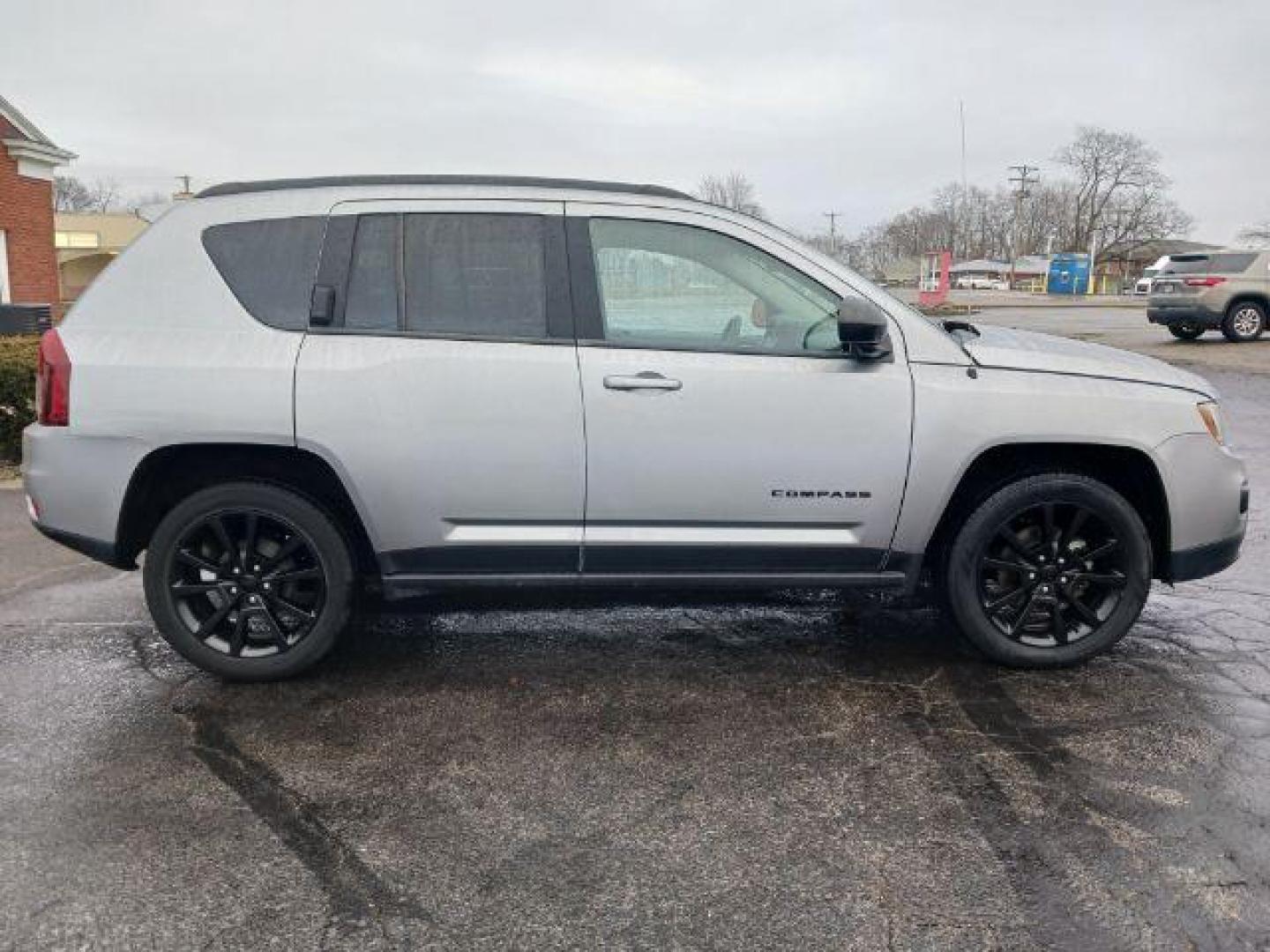 2014 Bright Silver Metallic CC Jeep Compass Sport FWD (1C4NJCBAXED) with an 2.0L L4 DOHC 16V engine, located at 1099 N County Rd 25A, Troy, OH, 45373, (937) 908-9800, 40.057079, -84.212883 - Photo#4