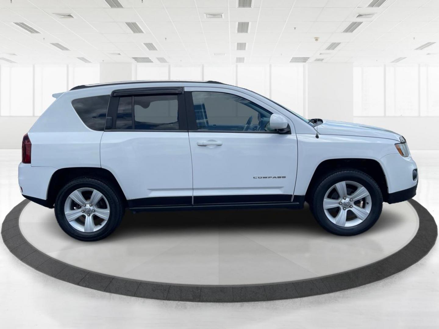 2014 Bright White Clearcoat Jeep Compass Latitude 4WD (1C4NJDEB8ED) with an 2.4L L4 DOHC 16V engine, Continuously Variable Transmission transmission, located at 1099 N County Rd 25A, Troy, OH, 45373, (937) 908-9800, 40.057079, -84.212883 - Photo#1