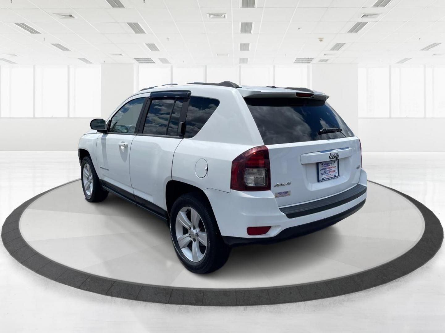 2014 Bright White Clearcoat Jeep Compass Latitude 4WD (1C4NJDEB8ED) with an 2.4L L4 DOHC 16V engine, Continuously Variable Transmission transmission, located at 1099 N County Rd 25A, Troy, OH, 45373, (937) 908-9800, 40.057079, -84.212883 - Photo#4