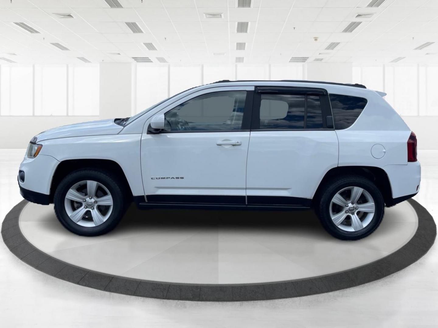 2014 Bright White Clearcoat Jeep Compass Latitude 4WD (1C4NJDEB8ED) with an 2.4L L4 DOHC 16V engine, Continuously Variable Transmission transmission, located at 1099 N County Rd 25A, Troy, OH, 45373, (937) 908-9800, 40.057079, -84.212883 - Photo#5