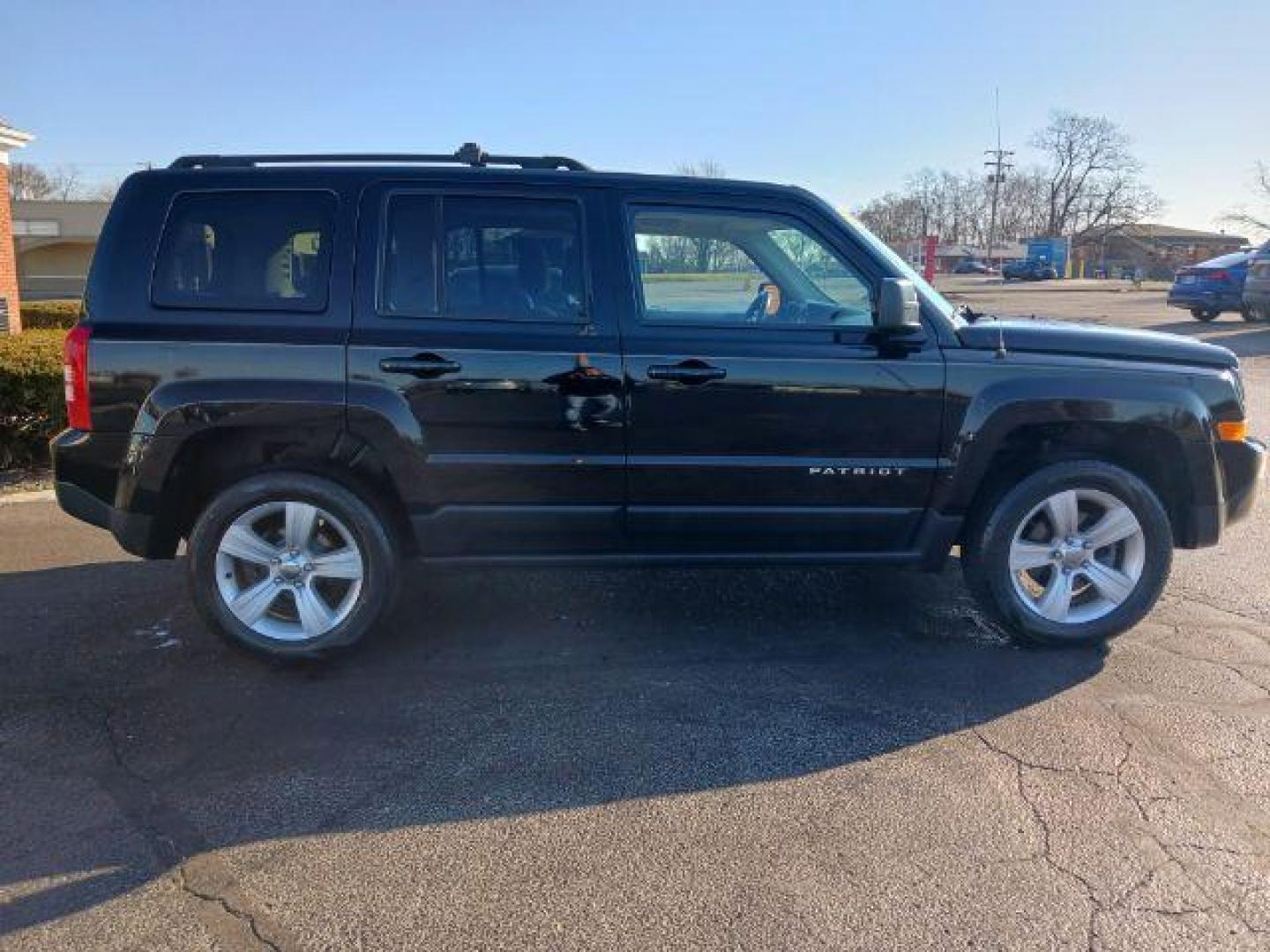 2014 Black Clearcoat Jeep Patriot Latitude 4WD (1C4NJRFB8ED) with an 2.4L L4 DOHC 16V engine, located at 401 Woodman Dr, Riverside, OH, 45431, (937) 908-9800, 39.760899, -84.123421 - Photo#4