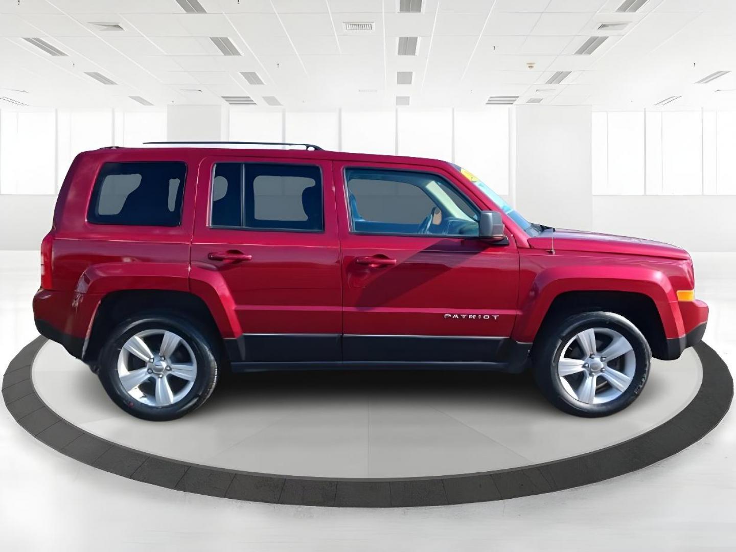 2014 Dp Cherry Red Crystal PC Jeep Patriot (1C4NJRFB0ED) with an 2.4L L4 DOHC 16V engine, located at 401 Woodman Dr, Riverside, OH, 45431, (937) 908-9800, 39.760899, -84.123421 - Photo#1