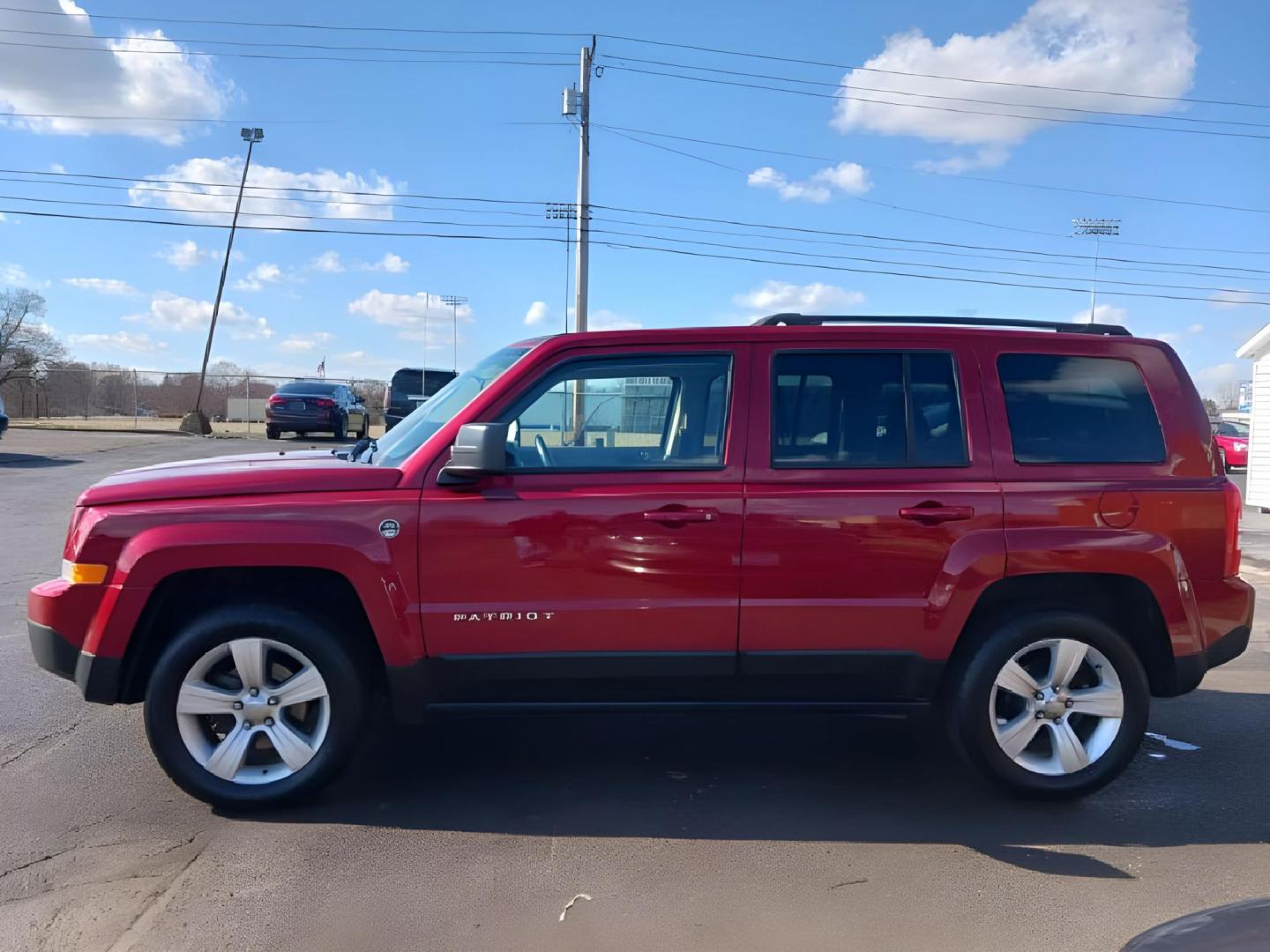 2014 Dp Cherry Red Crystal PC Jeep Patriot (1C4NJRFB0ED) with an 2.4L L4 DOHC 16V engine, located at 401 Woodman Dr, Riverside, OH, 45431, (937) 908-9800, 39.760899, -84.123421 - Photo#4