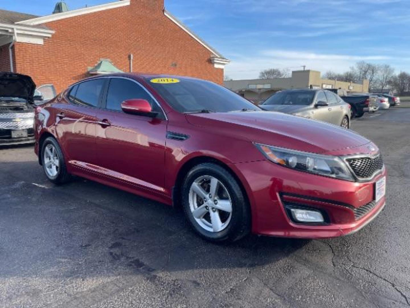 2014 Remington Red Metallic Kia Optima LX (5XXGM4A72EG) with an 2.4L L4 DOHC 16V engine, 6-Speed Automatic transmission, located at 401 Woodman Dr, Riverside, OH, 45431, (937) 908-9800, 39.760899, -84.123421 - Photo#0