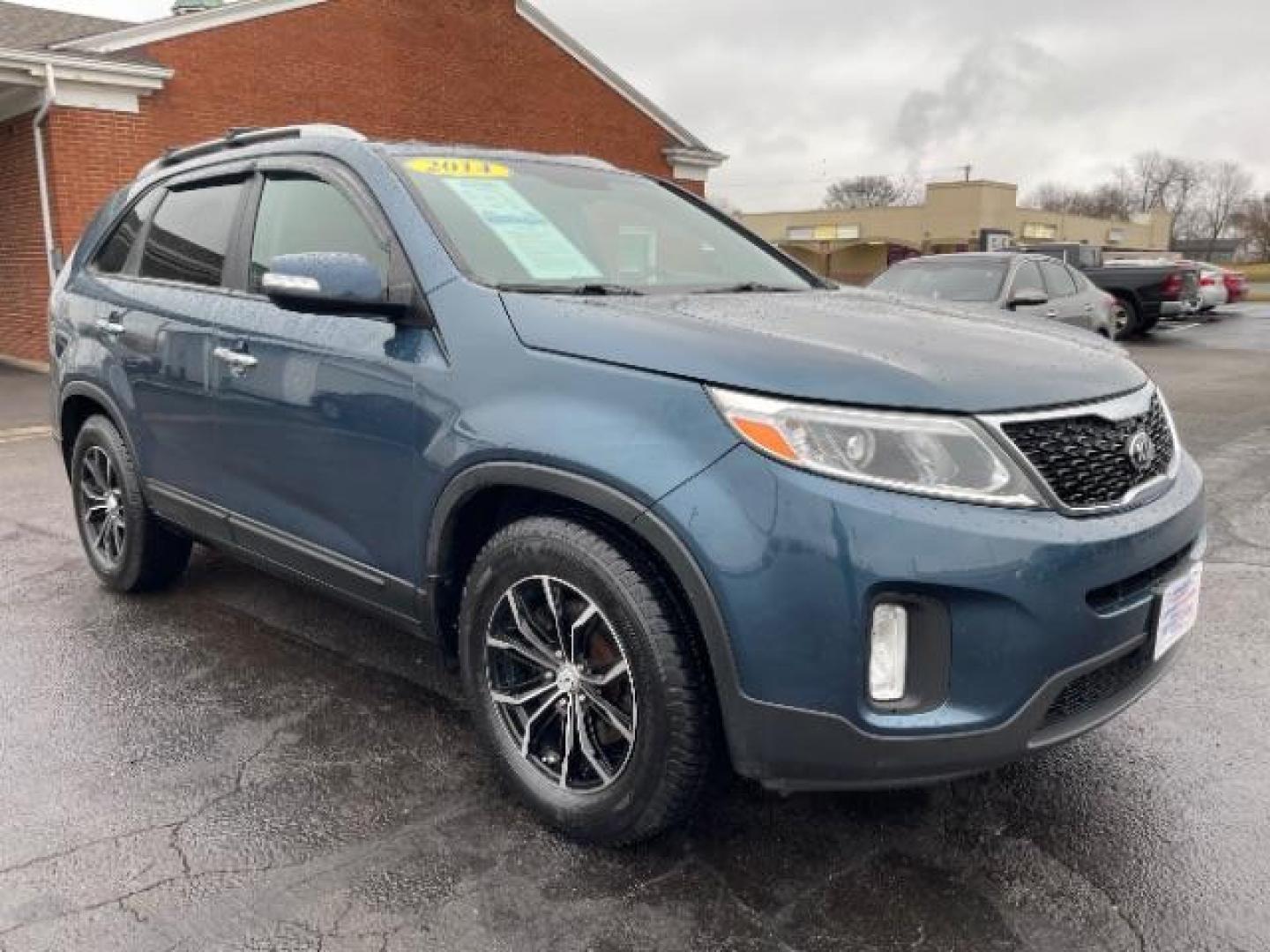 2014 Blue Kia Sorento LX 2WD (5XYKT3A64EG) with an 2.4L L4 DOHC 16V engine, 6-Speed Automatic transmission, located at 1099 N County Rd 25A, Troy, OH, 45373, (937) 908-9800, 40.057079, -84.212883 - Photo#0