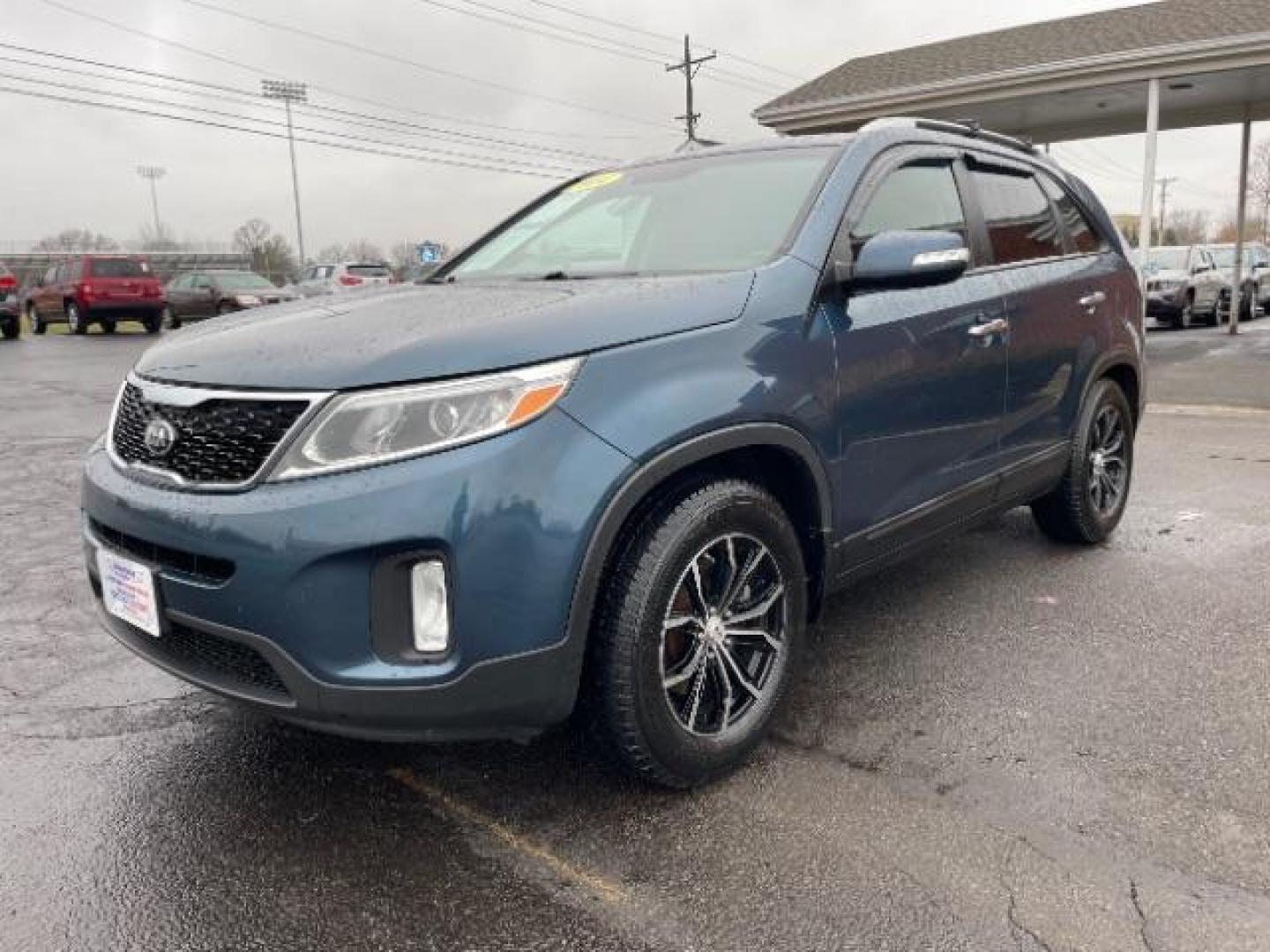 2014 Blue Kia Sorento LX 2WD (5XYKT3A64EG) with an 2.4L L4 DOHC 16V engine, 6-Speed Automatic transmission, located at 1099 N County Rd 25A, Troy, OH, 45373, (937) 908-9800, 40.057079, -84.212883 - Photo#1