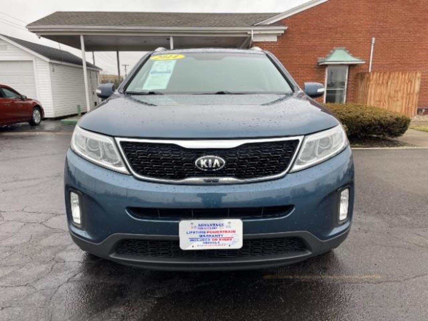 2014 Blue Kia Sorento LX 2WD (5XYKT3A64EG) with an 2.4L L4 DOHC 16V engine, 6-Speed Automatic transmission, located at 1099 N County Rd 25A, Troy, OH, 45373, (937) 908-9800, 40.057079, -84.212883 - Photo#4