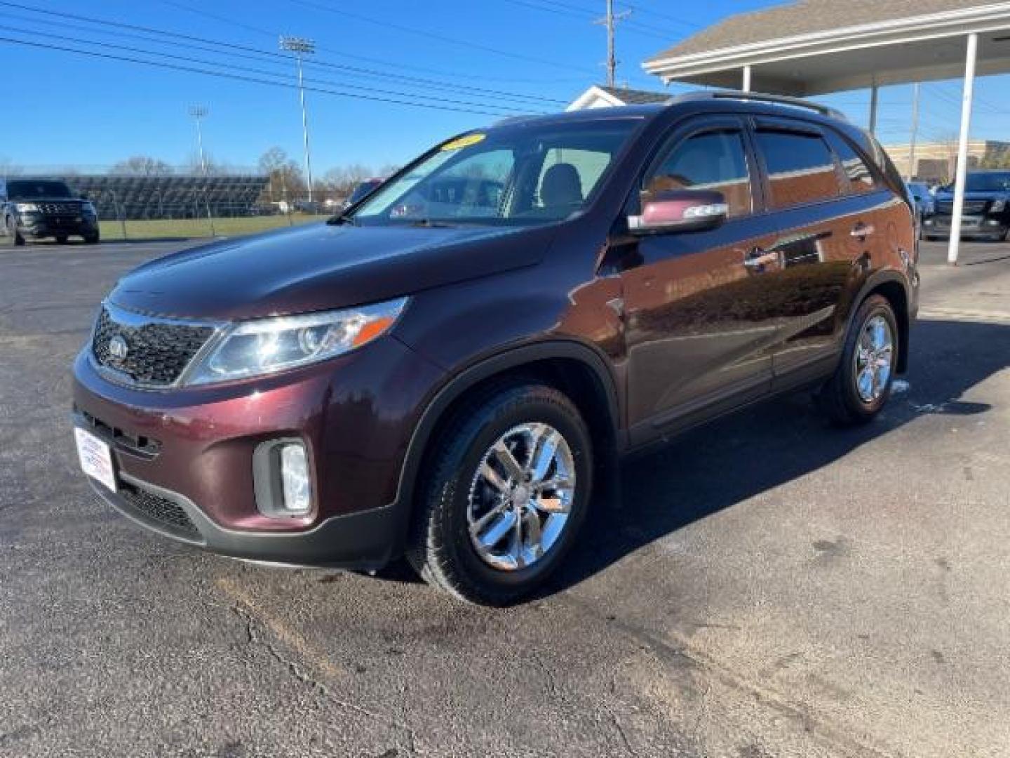 2014 Maroon Kia Sorento LX 2WD (5XYKT3A6XEG) with an 2.4L L4 DOHC 16V engine, 6-Speed Automatic transmission, located at 4508 South Dixie Dr, Moraine, OH, 45439, (937) 908-9800, 39.689976, -84.218452 - Photo#1