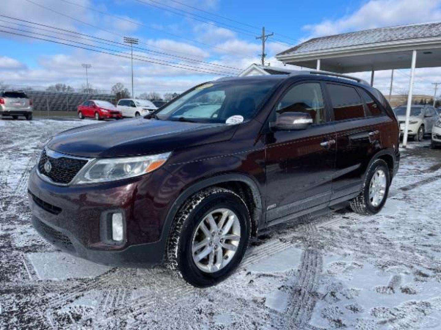 2014 Dark Cherry Kia Sorento LX AWD (5XYKTCA63EG) with an 2.4L L4 DOHC 16V engine, 6-Speed Automatic transmission, located at 1230 East Main St, Xenia, OH, 45385, (937) 908-9800, 39.688026, -83.910172 - Photo#1