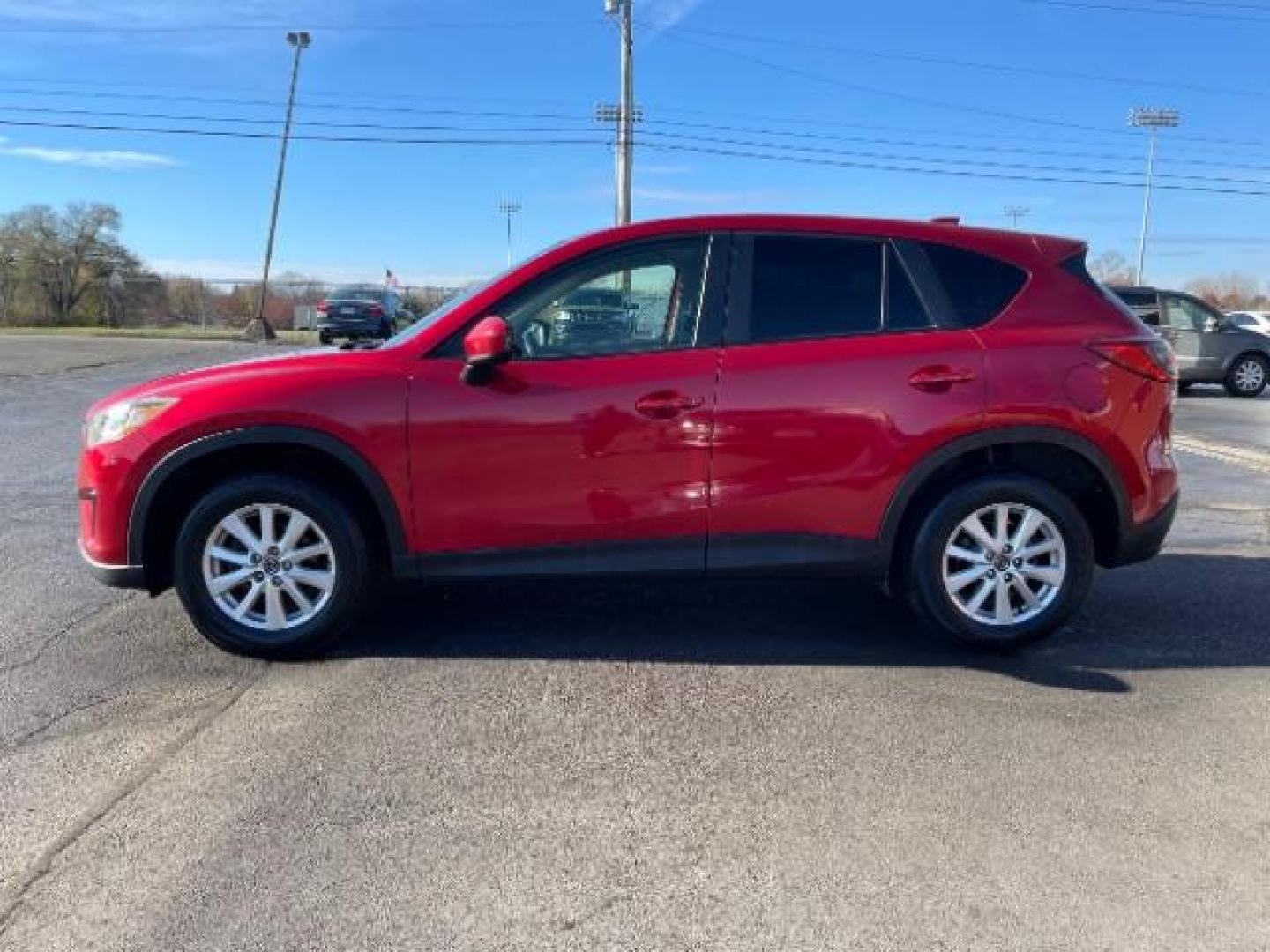 2014 Soul Red Metallic Mazda CX-5 Sport AT (JM3KE2BE7E0) with an 2.0L L4 DOHC 16V engine, 6-Speed Automatic transmission, located at 1230 East Main St, Xenia, OH, 45385, (937) 908-9800, 39.688026, -83.910172 - Photo#5