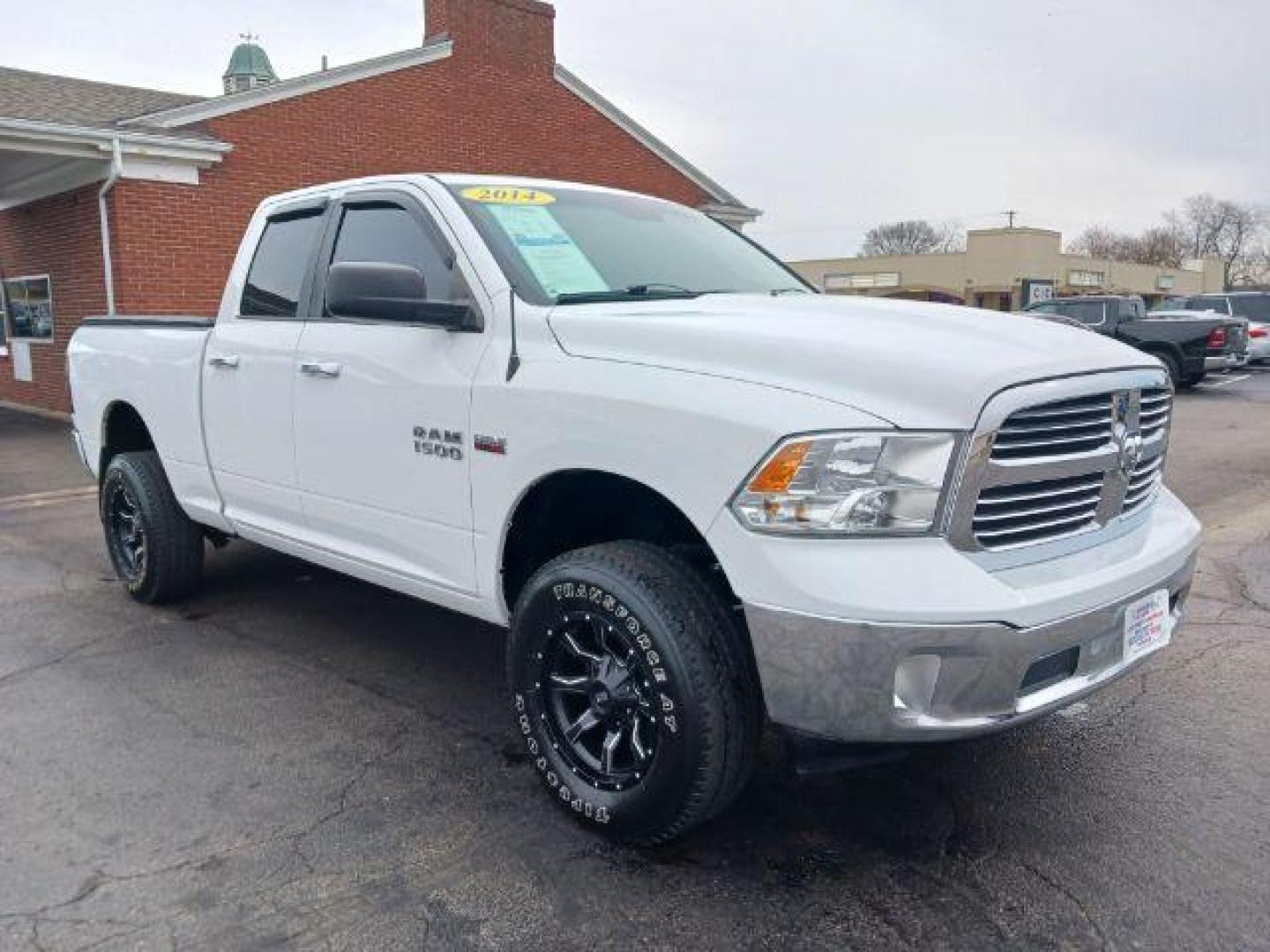 2014 Bright White Clearcoat RAM 1500 SLT Quad Cab 4WD (1C6RR7GT9ES) with an 5.7L V8 OHV 16V engine, 8-Speed Automatic transmission, located at 1099 N County Rd 25A, Troy, OH, 45373, (937) 908-9800, 40.057079, -84.212883 - Photo#0