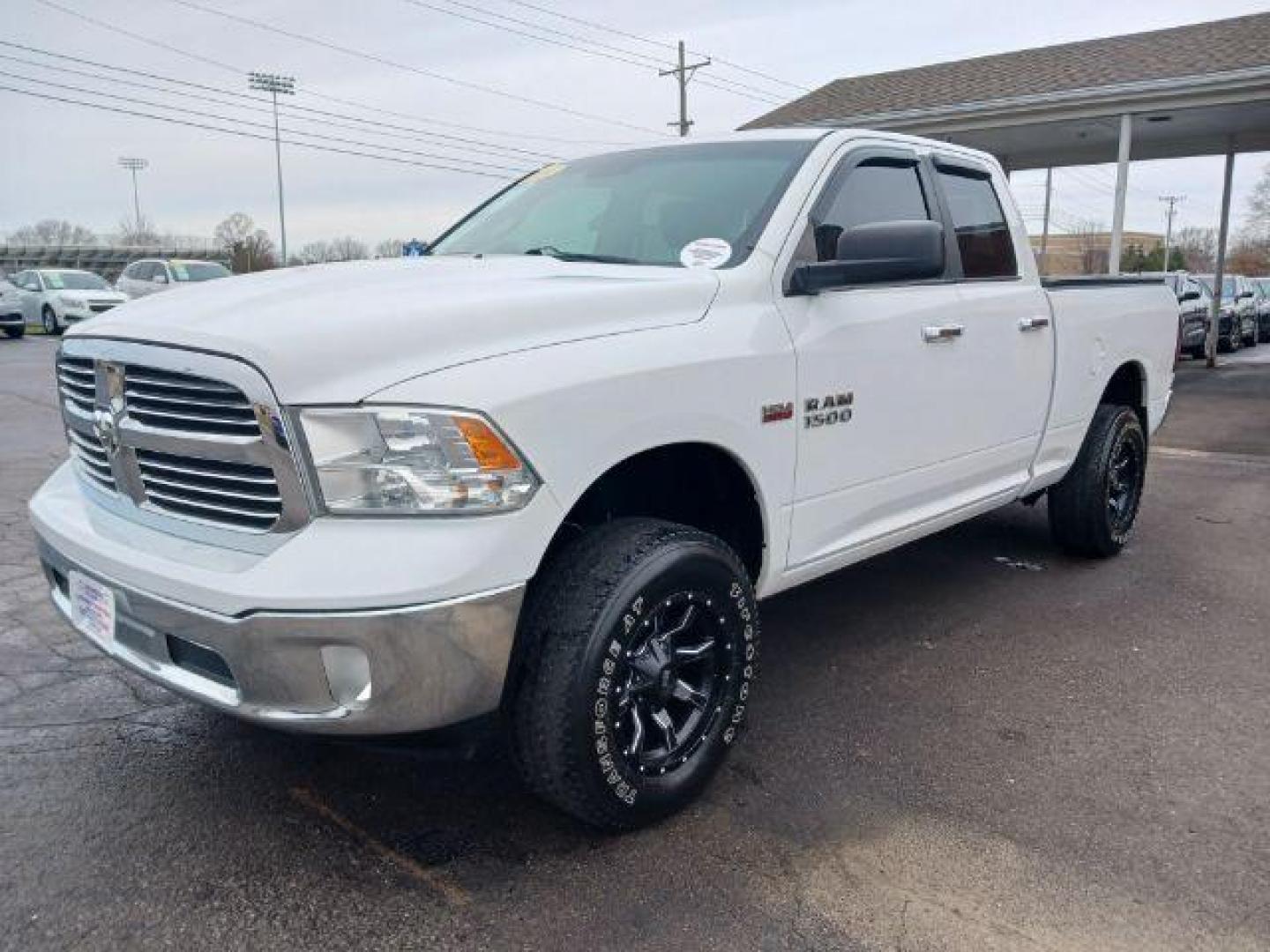 2014 Bright White Clearcoat RAM 1500 SLT Quad Cab 4WD (1C6RR7GT9ES) with an 5.7L V8 OHV 16V engine, 8-Speed Automatic transmission, located at 1099 N County Rd 25A, Troy, OH, 45373, (937) 908-9800, 40.057079, -84.212883 - Photo#2