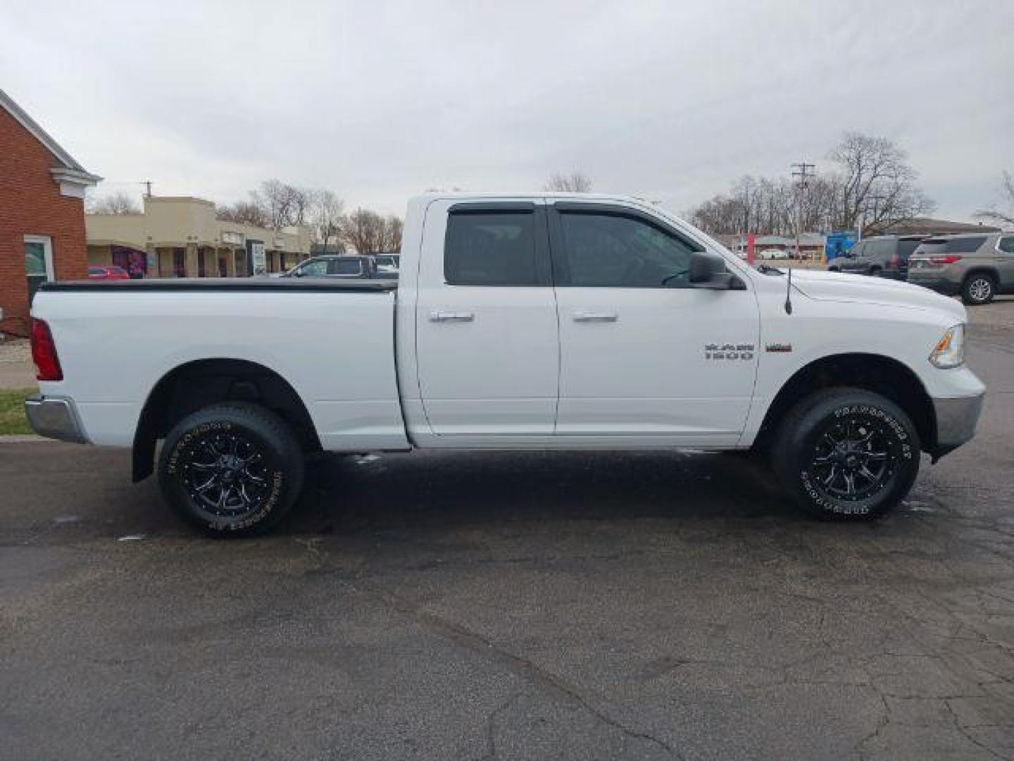 2014 Bright White Clearcoat RAM 1500 SLT Quad Cab 4WD (1C6RR7GT9ES) with an 5.7L V8 OHV 16V engine, 8-Speed Automatic transmission, located at 1099 N County Rd 25A, Troy, OH, 45373, (937) 908-9800, 40.057079, -84.212883 - Photo#4