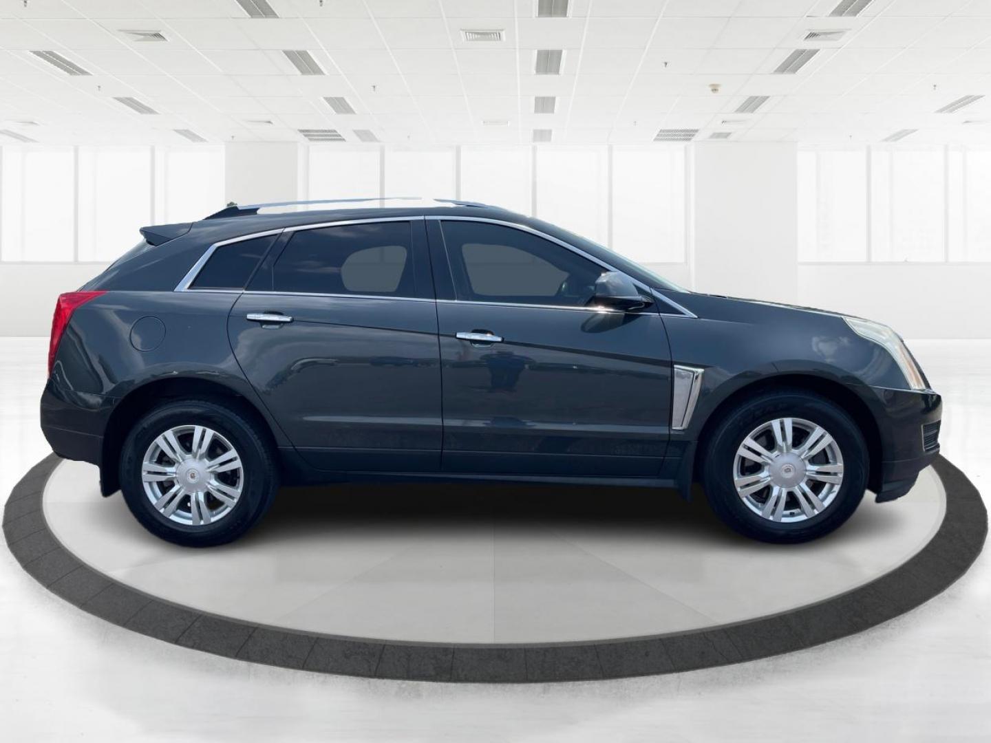 2015 Graphite Metallic Cadillac SRX Luxury Collection AWD (3GYFNEE31FS) with an 3.6L V6 DOHC 24V FFV engine, 6-Speed Automatic transmission, located at 1951 S Dayton Lakeview Rd., New Carlisle, OH, 45344, (937) 908-9800, 39.890999, -84.050255 - Photo#1