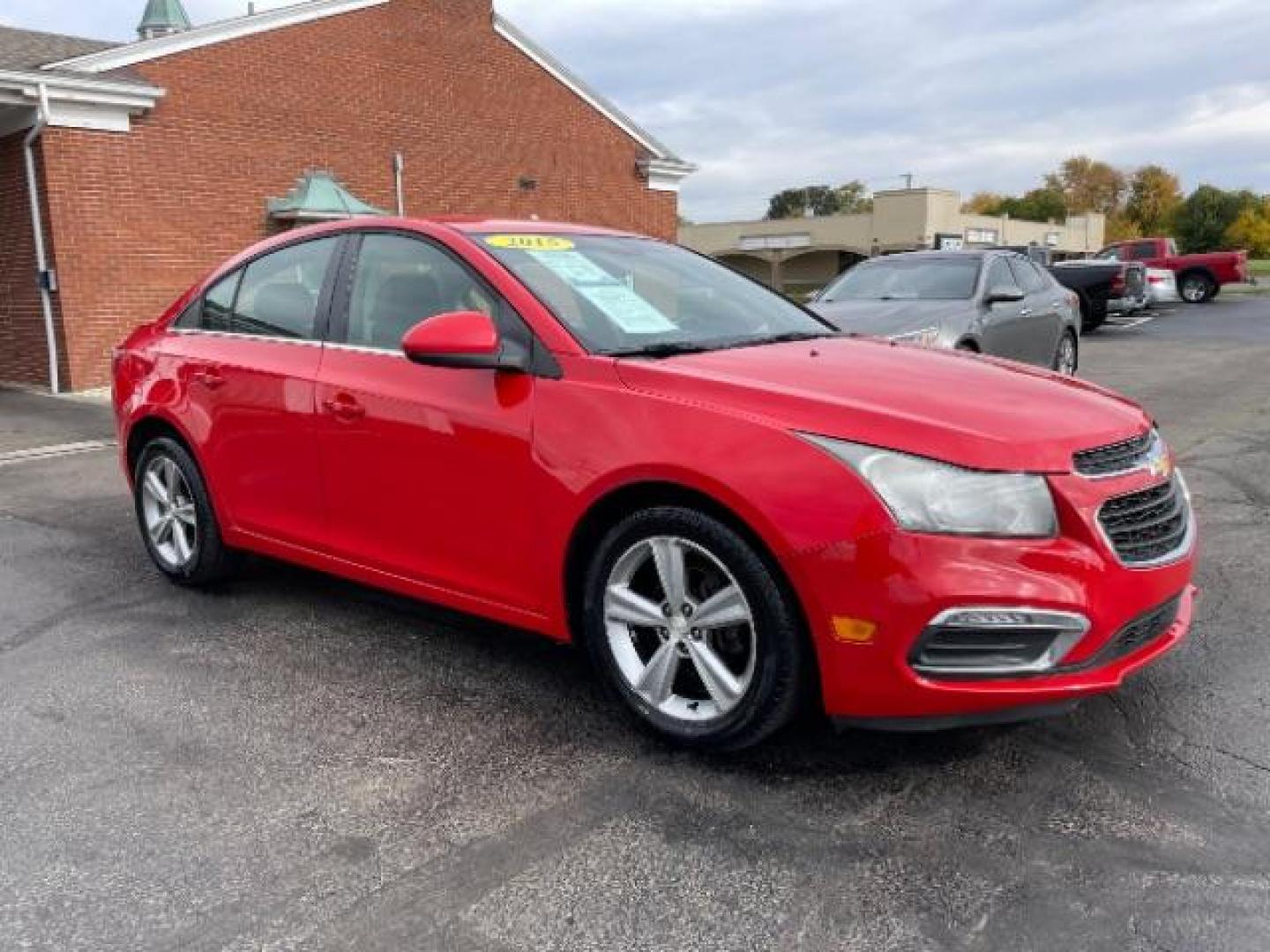 2015 Red Hot Chevrolet Cruze 2LT Auto (1G1PE5SB2F7) with an 1.4L L4 DOHC 16V TURBO engine, 6-Speed Automatic transmission, located at 1184 Kauffman Ave, Fairborn, OH, 45324, (937) 908-9800, 39.807072, -84.030914 - Photo#0