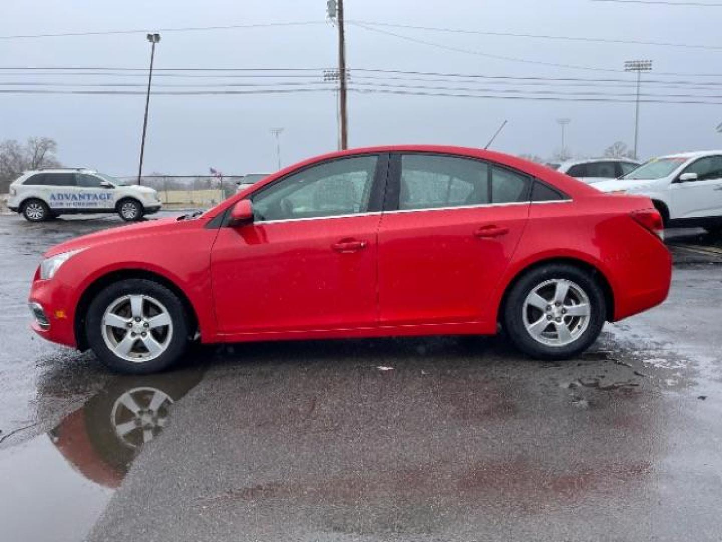 2015 Red Hot Chevrolet Cruze 1LT Auto (1G1PC5SB5F7) with an 1.4L L4 DOHC 16V TURBO engine, 6-Speed Automatic transmission, located at 1184 Kauffman Ave, Fairborn, OH, 45324, (937) 908-9800, 39.807072, -84.030914 - Photo#2