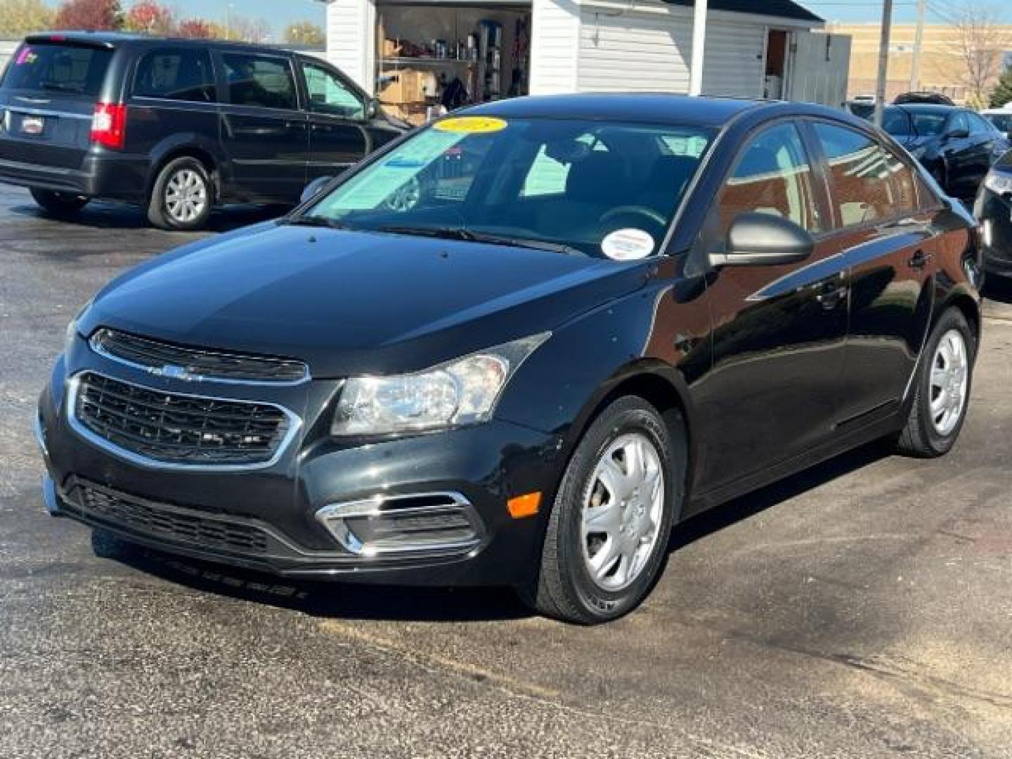 2015 Black Granite Metallic Chevrolet Cruze LS Auto (1G1PA5SHXF7) with an 1.8L L4 DOHC 16V FFV engine, 6-Speed Automatic transmission, located at 880 E. National Road, Vandalia, OH, 45377, (937) 908-9800, 39.891918, -84.183594 - Photo#2