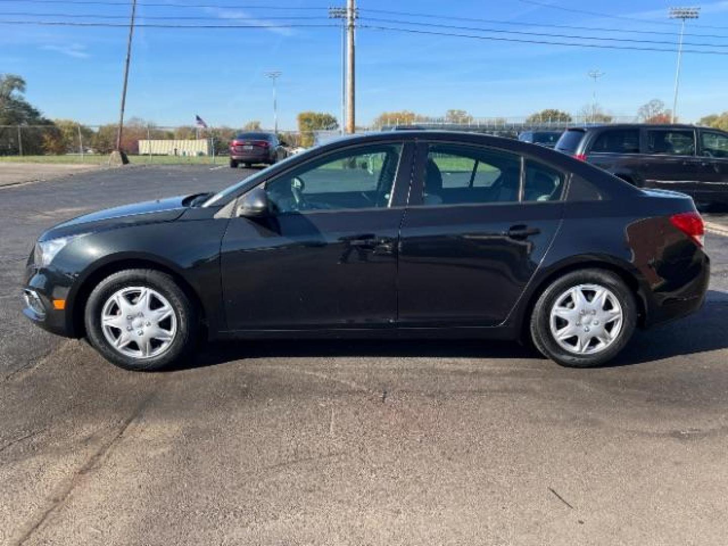 2015 Black Granite Metallic Chevrolet Cruze LS Auto (1G1PA5SHXF7) with an 1.8L L4 DOHC 16V FFV engine, 6-Speed Automatic transmission, located at 880 E. National Road, Vandalia, OH, 45377, (937) 908-9800, 39.891918, -84.183594 - Photo#3