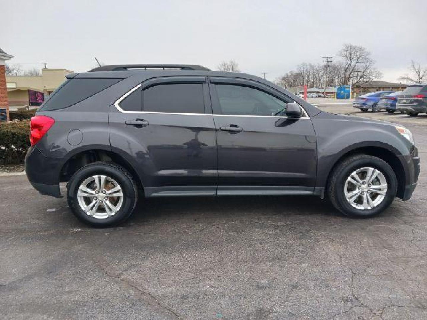 2015 Tungsten Metallic Chevrolet Equinox 1LT 2WD (1GNALBEK9FZ) with an 2.4L L4 DOHC 16V FFV engine, 6-Speed Automatic transmission, located at 1099 N County Rd 25A, Troy, OH, 45373, (937) 908-9800, 40.057079, -84.212883 - Photo#4