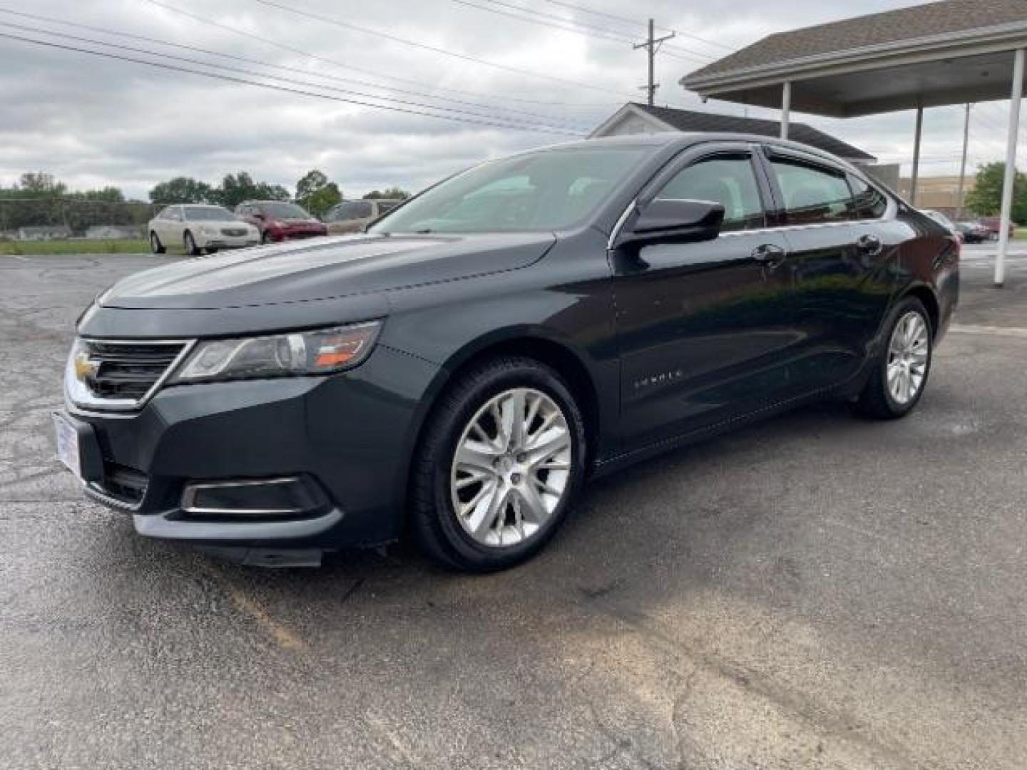 2015 Black Chevrolet Impala LS (2G11Z5SL6F9) with an 2.5L L4 DOHC 16V engine, 6-Speed Automatic transmission, located at 1099 N County Rd 25A, Troy, OH, 45373, (937) 908-9800, 40.057079, -84.212883 - Photo#1