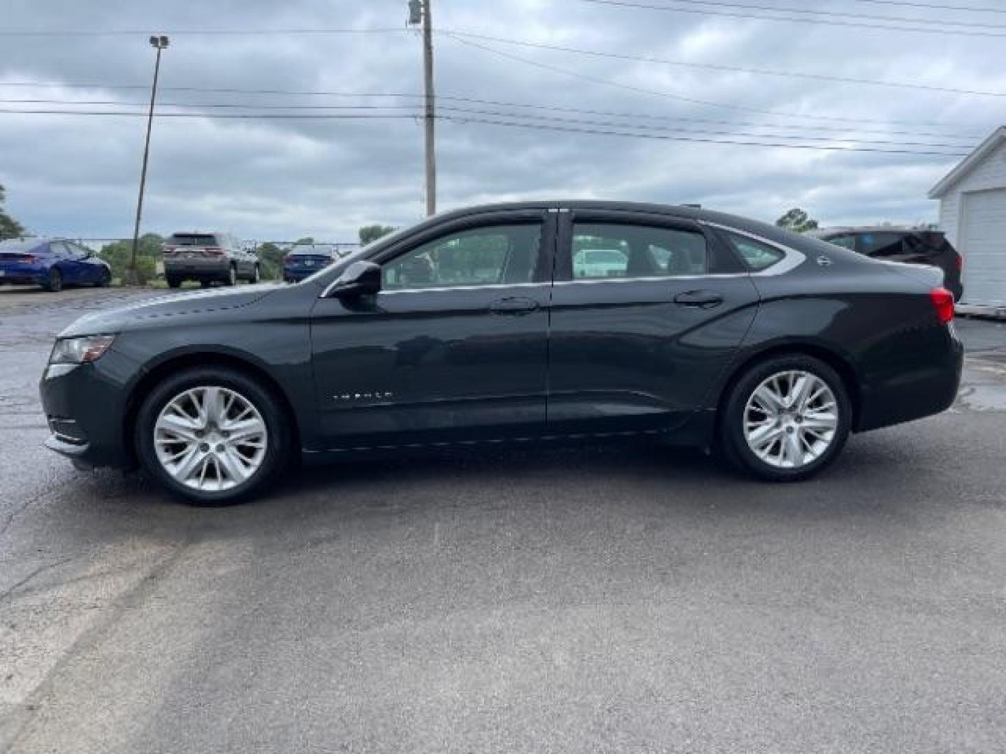 2015 Black Chevrolet Impala LS (2G11Z5SL6F9) with an 2.5L L4 DOHC 16V engine, 6-Speed Automatic transmission, located at 1099 N County Rd 25A, Troy, OH, 45373, (937) 908-9800, 40.057079, -84.212883 - Photo#2