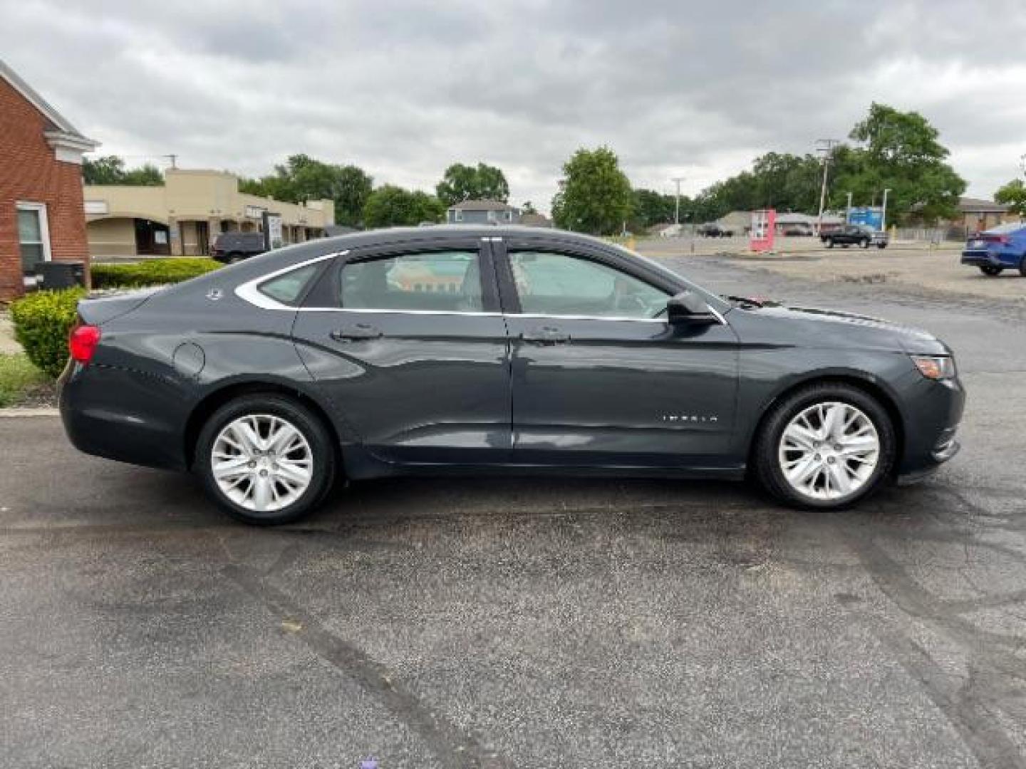 2015 Black Chevrolet Impala LS (2G11Z5SL6F9) with an 2.5L L4 DOHC 16V engine, 6-Speed Automatic transmission, located at 1099 N County Rd 25A, Troy, OH, 45373, (937) 908-9800, 40.057079, -84.212883 - Photo#3