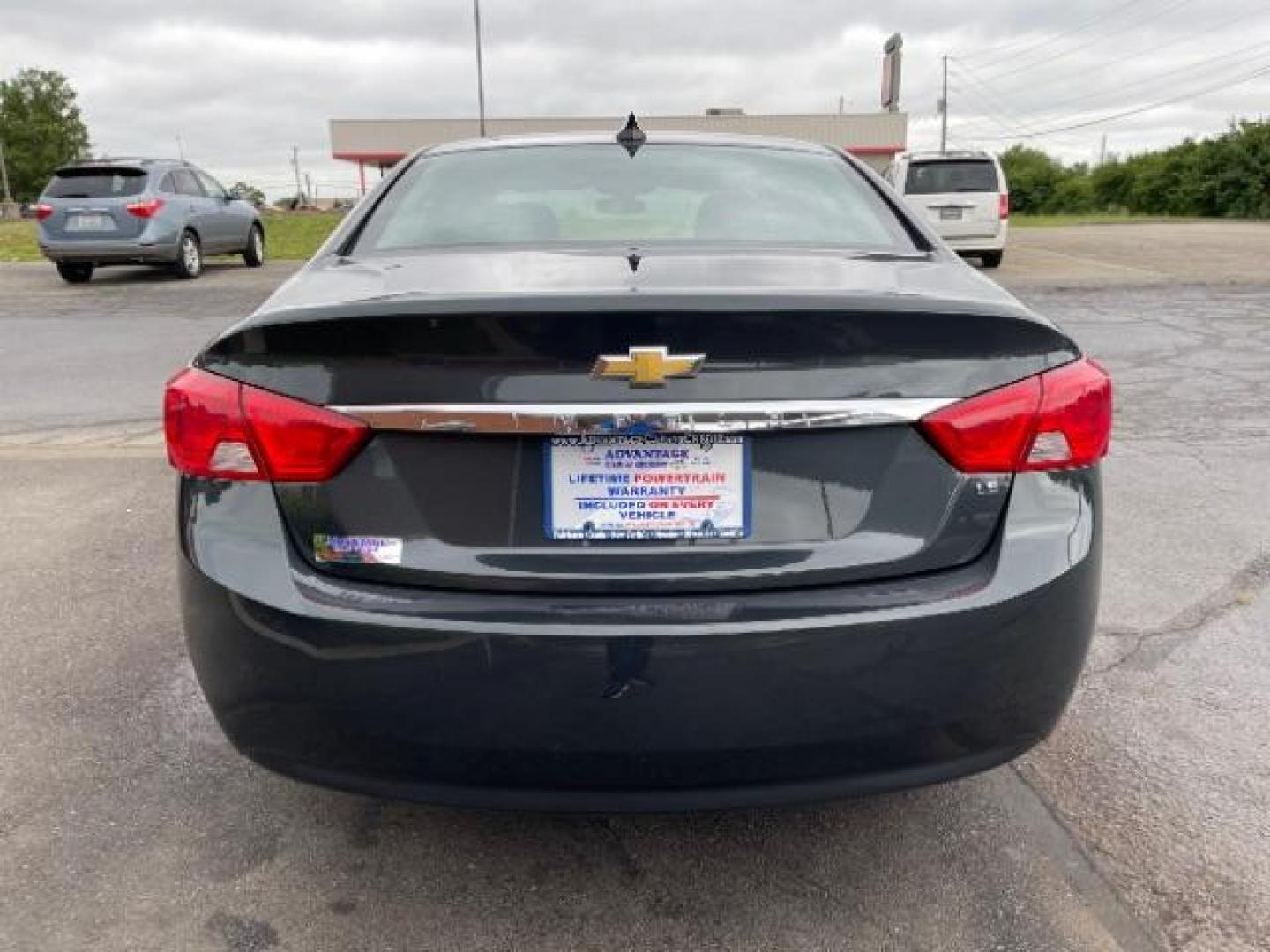 2015 Black Chevrolet Impala LS (2G11Z5SL6F9) with an 2.5L L4 DOHC 16V engine, 6-Speed Automatic transmission, located at 1099 N County Rd 25A, Troy, OH, 45373, (937) 908-9800, 40.057079, -84.212883 - Photo#4