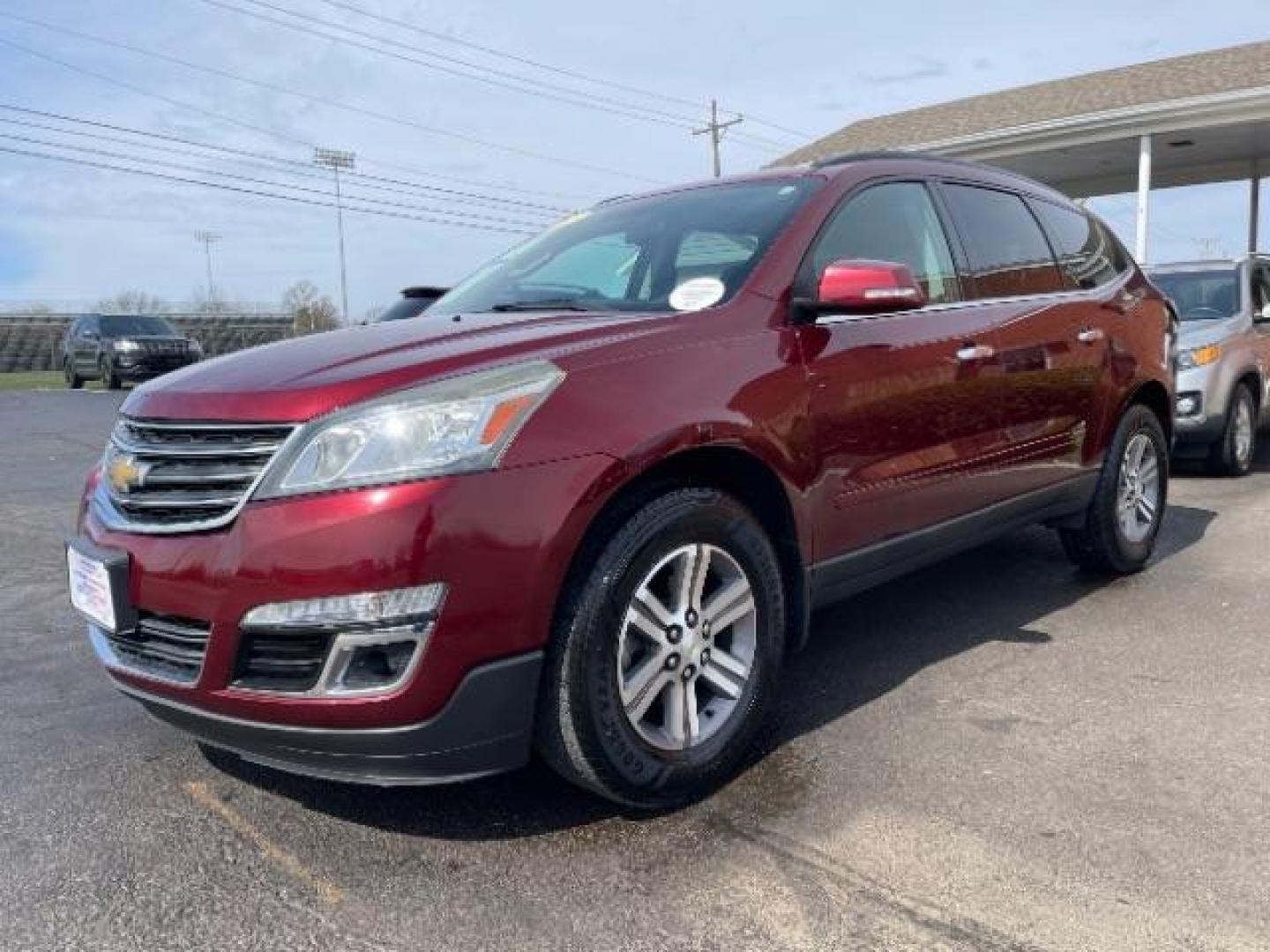 2015 Siren Red Tintcoat Chevrolet Traverse 2LT AWD (1GNKVHKD7FJ) with an 3.6L V6 DOHC 24V engine, 6-Speed Automatic transmission, located at 1099 N County Rd 25A, Troy, OH, 45373, (937) 908-9800, 40.057079, -84.212883 - Photo#1