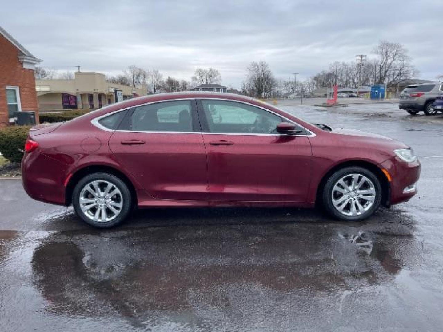 2015 Velvet Red Pearlcoat Chrysler 200 Limited (1C3CCCAB3FN) with an 2.4L L4 DOHC 16V engine, 9-Speed Automatic transmission, located at 401 Woodman Dr, Riverside, OH, 45431, (937) 908-9800, 39.760899, -84.123421 - Photo#4