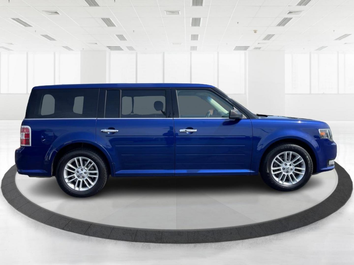 2015 Deep Impact Blue Metallic Ford Flex SEL AWD (2FMHK6C87FB) with an 3.5L V6 DOHC 24V engine, 6-Speed Automatic Overdrive transmission, located at 880 E. National Road, Vandalia, OH, 45377, (937) 908-9800, 39.891918, -84.183594 - Photo#1