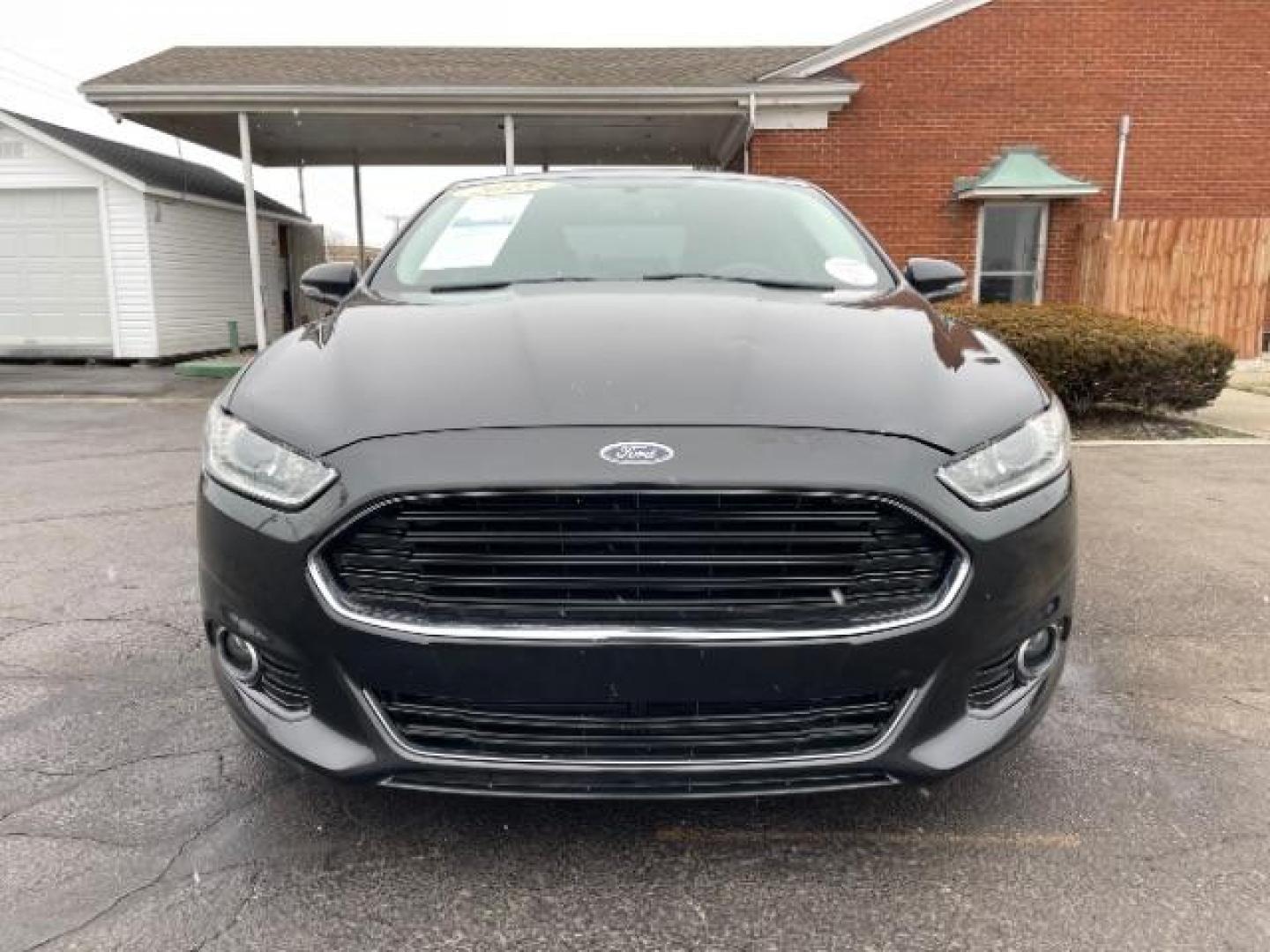 2015 Tuxedo Black Ford Fusion Titanium (3FA6P0K99FR) with an 2.0L L4 DOHC 16V engine, 6-Speed Automatic transmission, located at 401 Woodman Dr, Riverside, OH, 45431, (937) 908-9800, 39.760899, -84.123421 - Photo#4