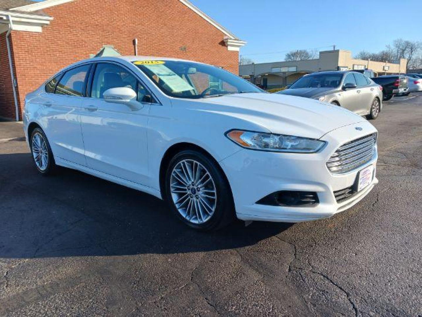 2015 White Platinum Met TC Ford Fusion SE (3FA6P0HD5FR) with an 1.5L L4 DOHC 16V engine, 6-Speed Automatic transmission, located at 1951 S Dayton Lakeview Rd., New Carlisle, OH, 45344, (937) 908-9800, 39.890999, -84.050255 - Photo#0