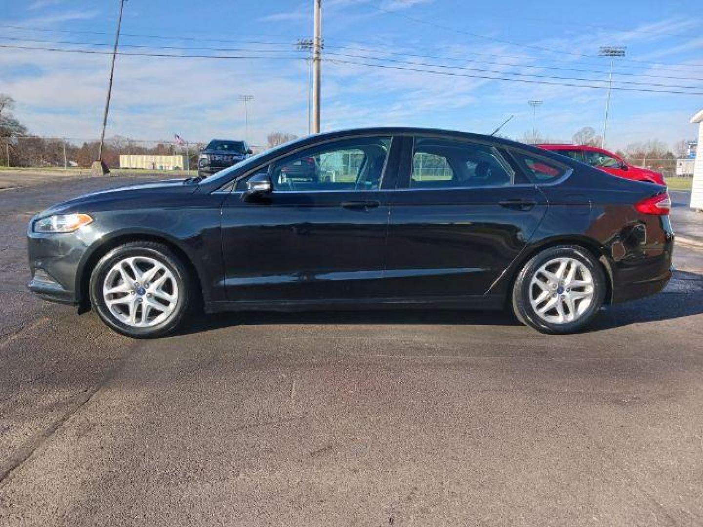 2015 Tuxedo Black Ford Fusion SE (3FA6P0H7XFR) with an 2.5L L4 DOHC 16V engine, 6-Speed Automatic transmission, located at 1230 East Main St, Xenia, OH, 45385, (937) 908-9800, 39.688026, -83.910172 - Photo#3