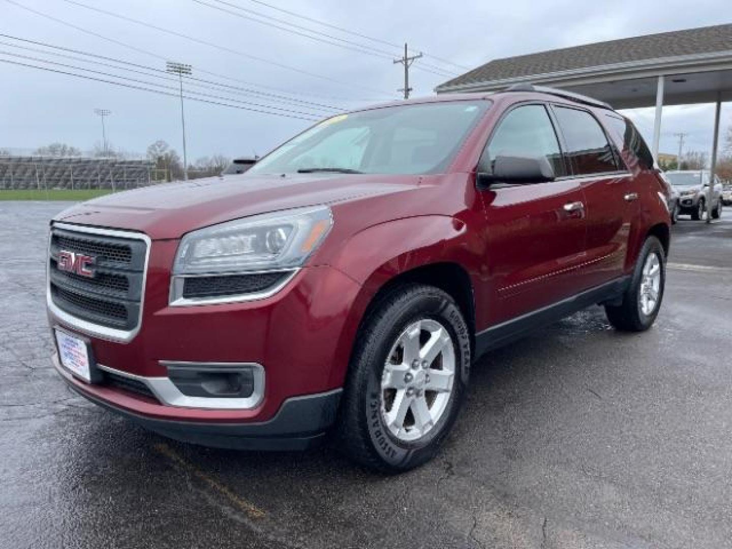 2015 Crimson Red Tincoat GMC Acadia SLE-2 AWD (1GKKVPKDXFJ) with an 3.6L V6 DOHC 24V engine, 6-Speed Automatic transmission, located at 1099 N County Rd 25A, Troy, OH, 45373, (937) 908-9800, 40.057079, -84.212883 - Photo#1