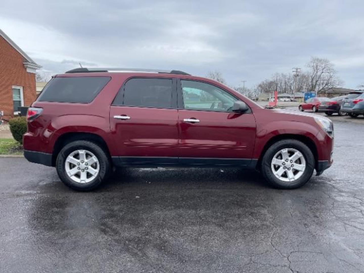 2015 Crimson Red Tincoat GMC Acadia SLE-2 AWD (1GKKVPKDXFJ) with an 3.6L V6 DOHC 24V engine, 6-Speed Automatic transmission, located at 1099 N County Rd 25A, Troy, OH, 45373, (937) 908-9800, 40.057079, -84.212883 - Photo#3