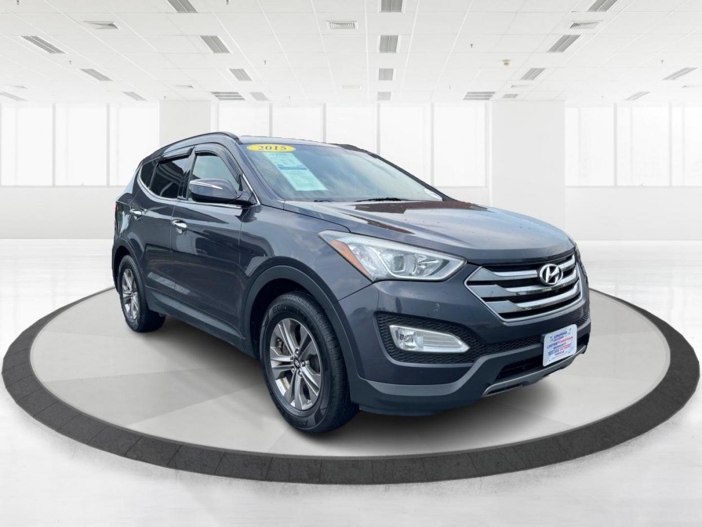 2015 Mineral Gray Hyundai Santa Fe (5XYZUDLB8FG) with an 2.4L L4 DOHC 16V engine, 6-Speed Automatic transmission, located at 880 E. National Road, Vandalia, OH, 45377, (937) 908-9800, 39.891918, -84.183594 - Photo#0