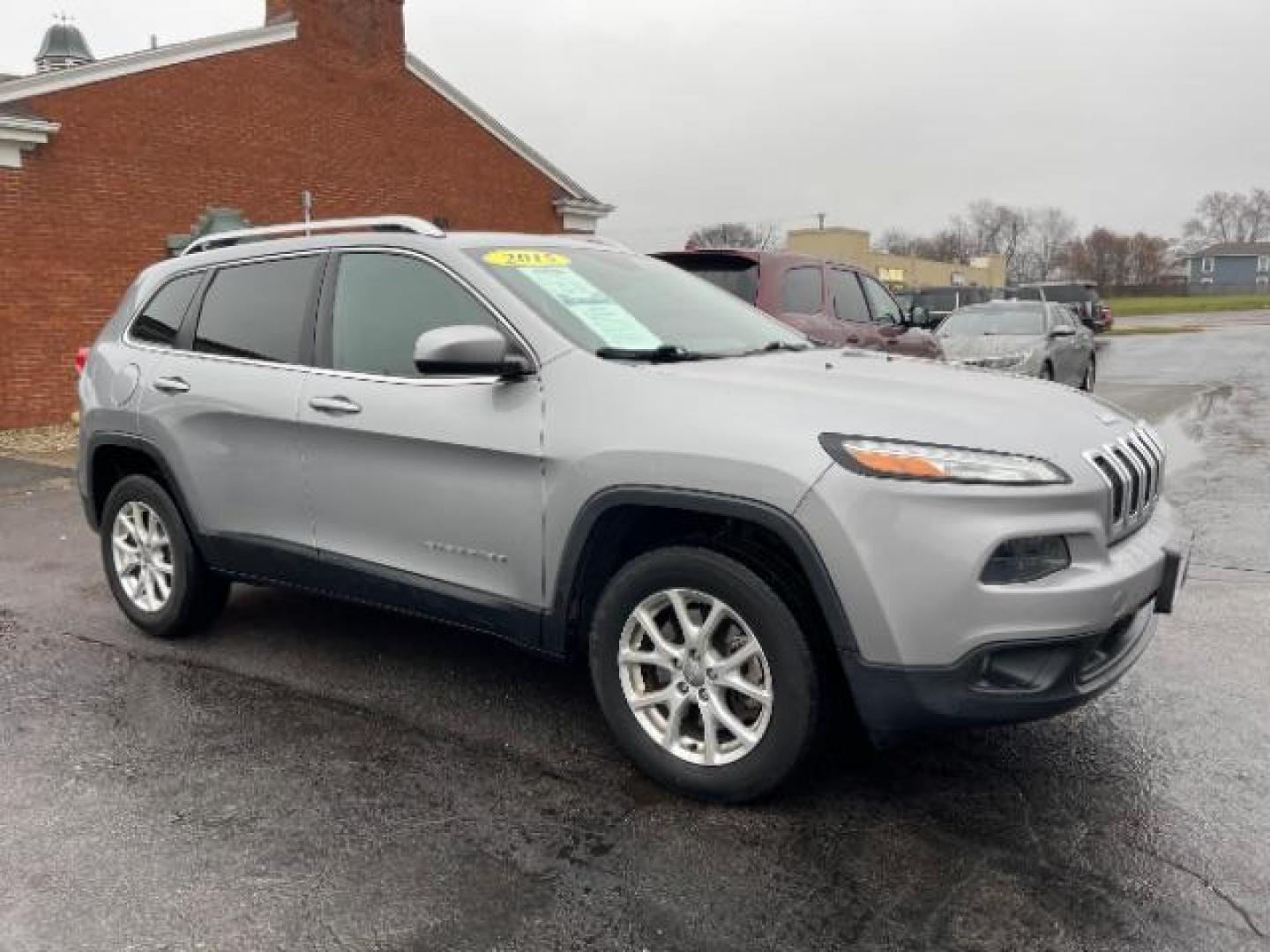 2015 Billet Silver Metallic CC Jeep Cherokee Latitude 4WD (1C4PJMCBXFW) with an 2.4L L4 DOHC 16V engine, 9-Speed Automatic transmission, located at 1099 N County Rd 25A, Troy, OH, 45373, (937) 908-9800, 40.057079, -84.212883 - Photo#0