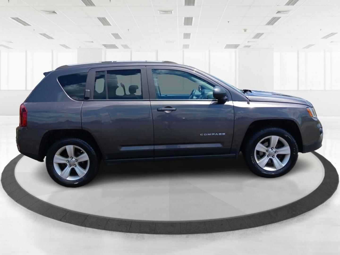 2015 Granite Crystal Metallic Clear Coat Jeep Compass (1C4NJDEB4FD) with an 2.4L L4 DOHC 16V engine, 6-Speed Automatic transmission, located at 1099 N County Rd 25A, Troy, OH, 45373, (937) 908-9800, 40.057079, -84.212883 - Photo#1