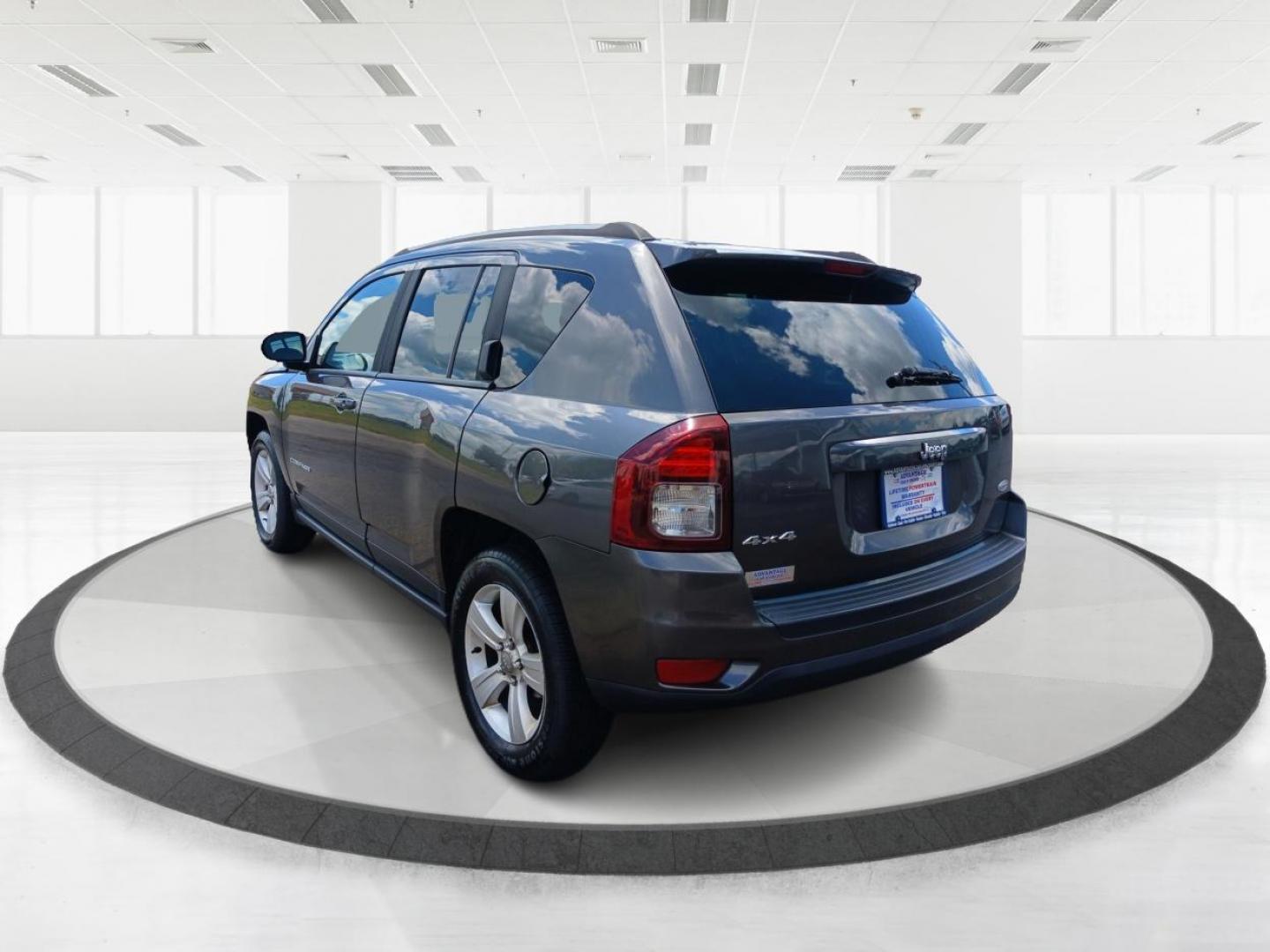 2015 Granite Crystal Metallic Clear Coat Jeep Compass (1C4NJDEB4FD) with an 2.4L L4 DOHC 16V engine, 6-Speed Automatic transmission, located at 1099 N County Rd 25A, Troy, OH, 45373, (937) 908-9800, 40.057079, -84.212883 - Photo#4