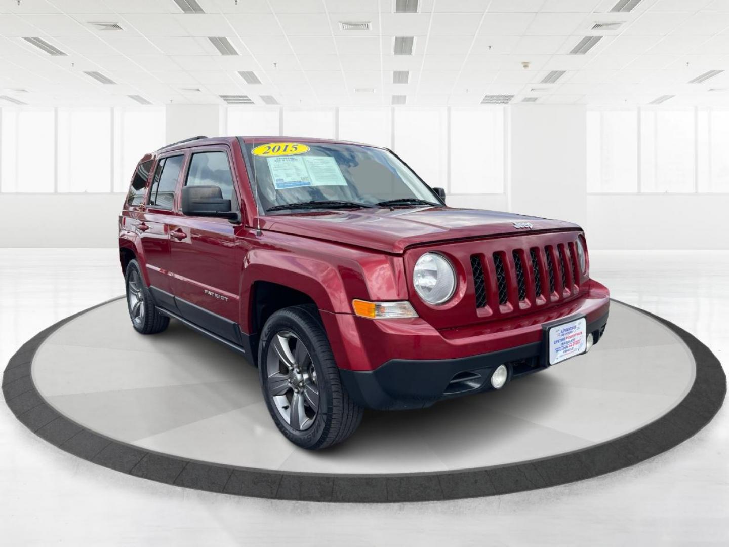 2015 Dp Cherry Red Crystal PC Jeep Patriot Latitude 2WD (1C4NJPFA1FD) with an 2.0L L4 DOHC 16V engine, located at 1184 Kauffman Ave, Fairborn, OH, 45324, (937) 908-9800, 39.807072, -84.030914 - Photo#0