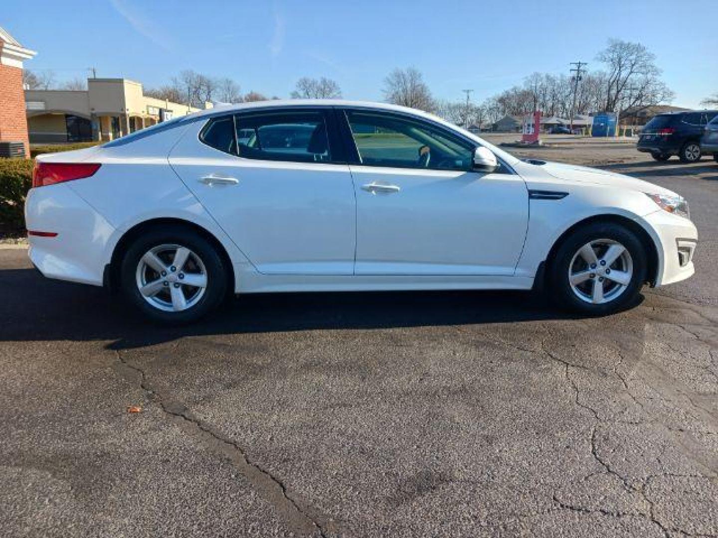 2015 Snow White Pearl Kia Optima LX (KNAGM4A71F5) with an 2.4L L4 DOHC 16V engine, 6-Speed Automatic transmission, located at 4508 South Dixie Dr, Moraine, OH, 45439, (937) 908-9800, 39.689976, -84.218452 - Photo#4