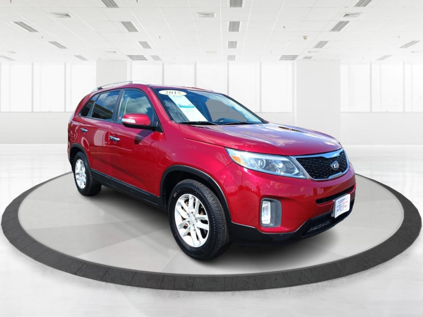 2015 Remington Red Metallic Kia Sorento (5XYKT4A65FG) with an 2.4L L4 DOHC 16V engine, 6-Speed Automatic transmission, located at 4508 South Dixie Dr, Moraine, OH, 45439, (937) 908-9800, 39.689976, -84.218452 - Photo#0