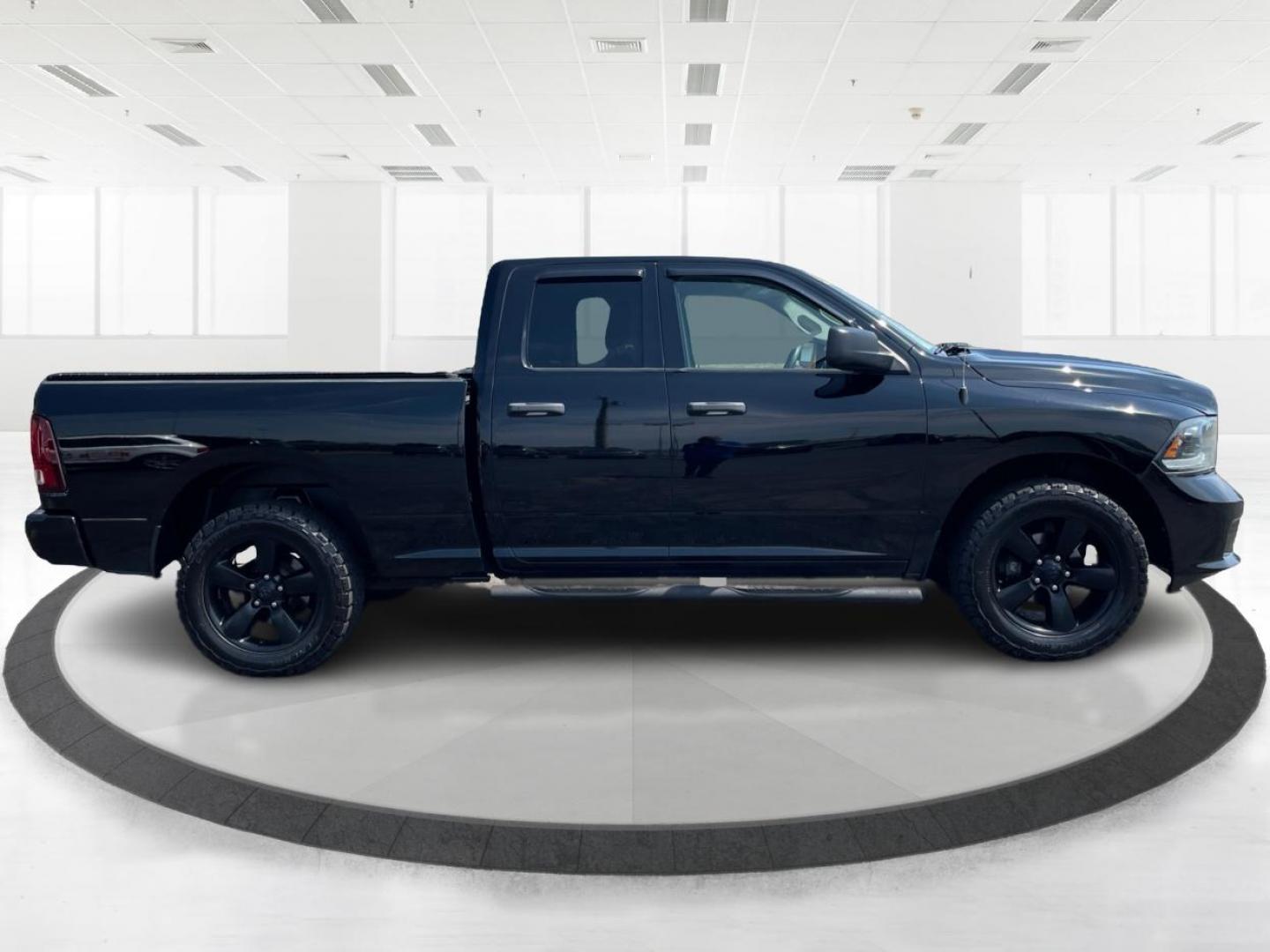 2015 Black RAM 1500 Tradesman Quad Cab 4WD (1C6RR7FTXFS) with an 5.7L V8 OHV 16V engine, 8-Speed Automatic transmission, located at 1184 Kauffman Ave, Fairborn, OH, 45324, (937) 908-9800, 39.807072, -84.030914 - Photo#1