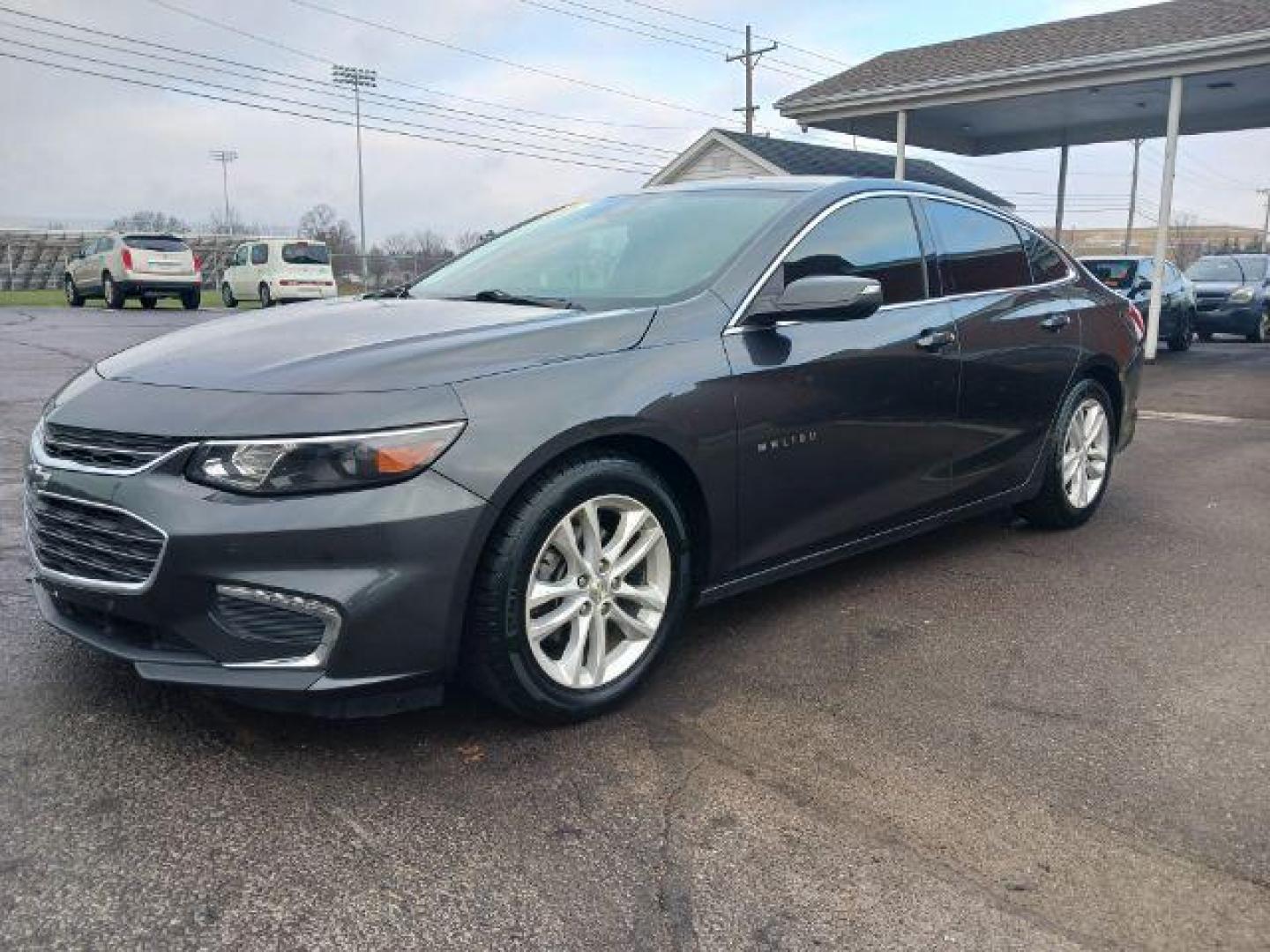 2016 Mosaic Black Metallic Chevrolet Malibu 1LT (1G1ZE5ST7GF) with an 1.5L L4 DOHC 16V engine, 6-Speed Automatic transmission, located at 880 E. National Road, Vandalia, OH, 45377, (937) 908-9800, 39.891918, -84.183594 - Photo#2