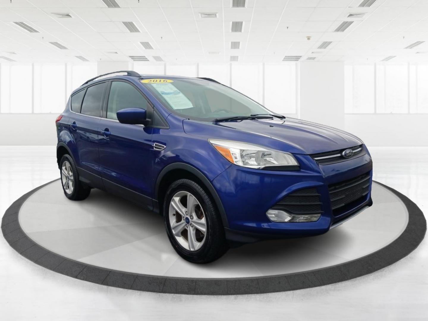 2016 Deep Impact Blue Metallic Ford Escape SE 4WD (1FMCU9G9XGU) with an 2.0L L4 DOHC 16V engine, 6-Speed Automatic transmission, located at 4508 South Dixie Dr, Moraine, OH, 45439, (937) 908-9800, 39.689976, -84.218452 - Photo#0