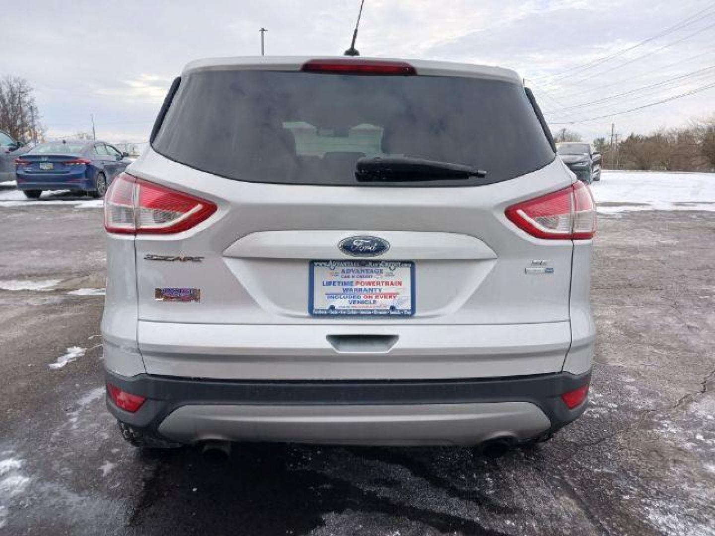 2016 Ingot Silver Metallic Ford Escape SE 4WD (1FMCU9G96GU) with an 2.0L L4 DOHC 16V engine, 6-Speed Automatic transmission, located at 880 E. National Road, Vandalia, OH, 45377, (937) 908-9800, 39.891918, -84.183594 - Photo#5